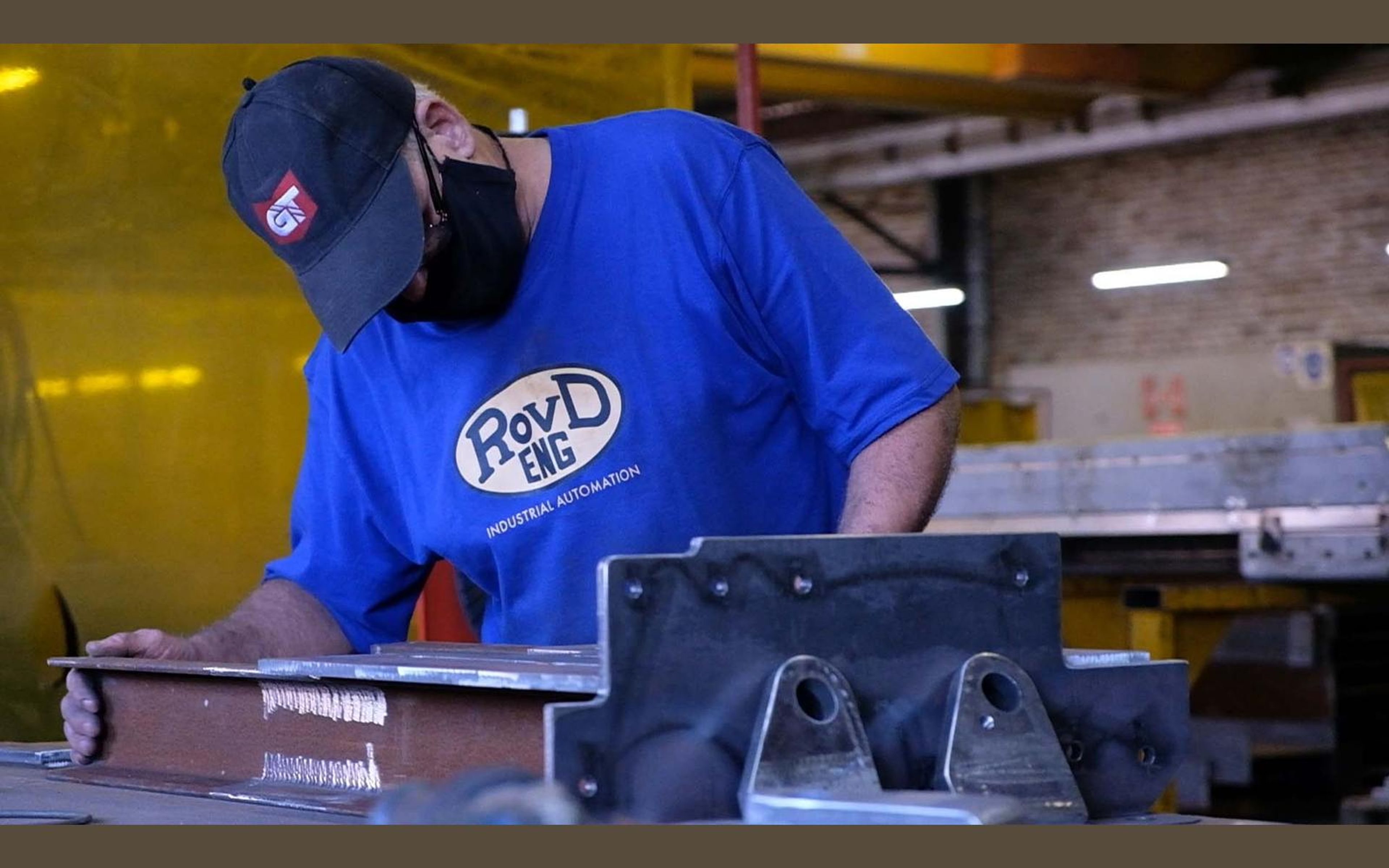 Fabricator in a ROVD Engineered to Work shirt at the bench
