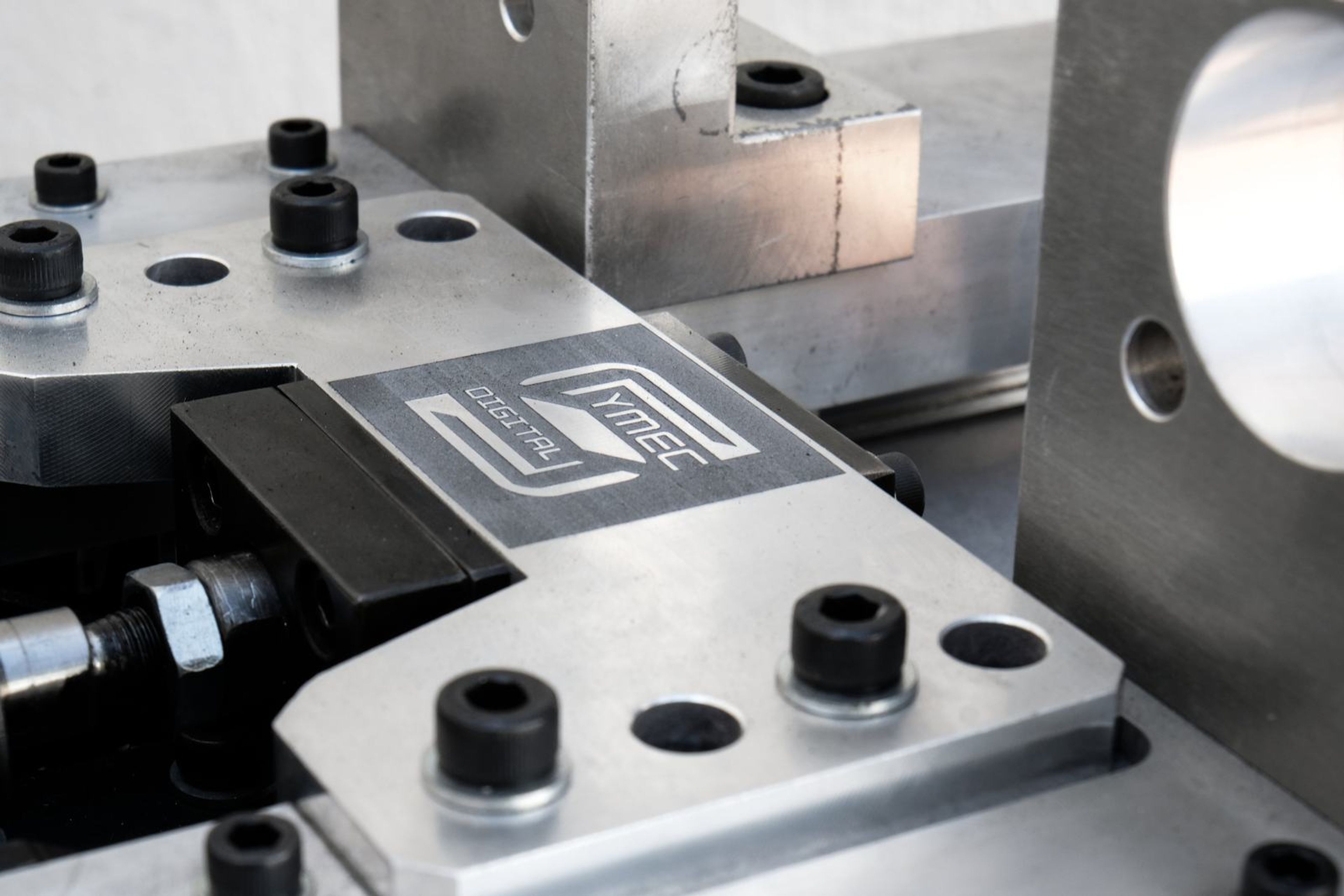 Close view of the clamping plate and bolt heads on the bolting tool