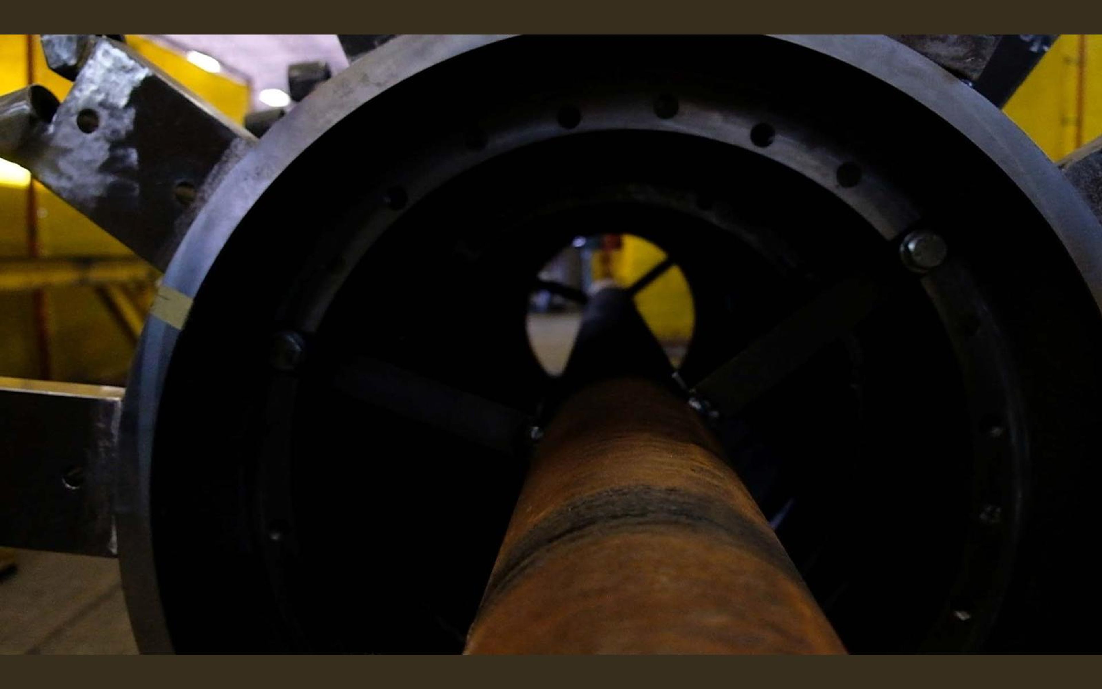 Looking along the inside of a large steel tube