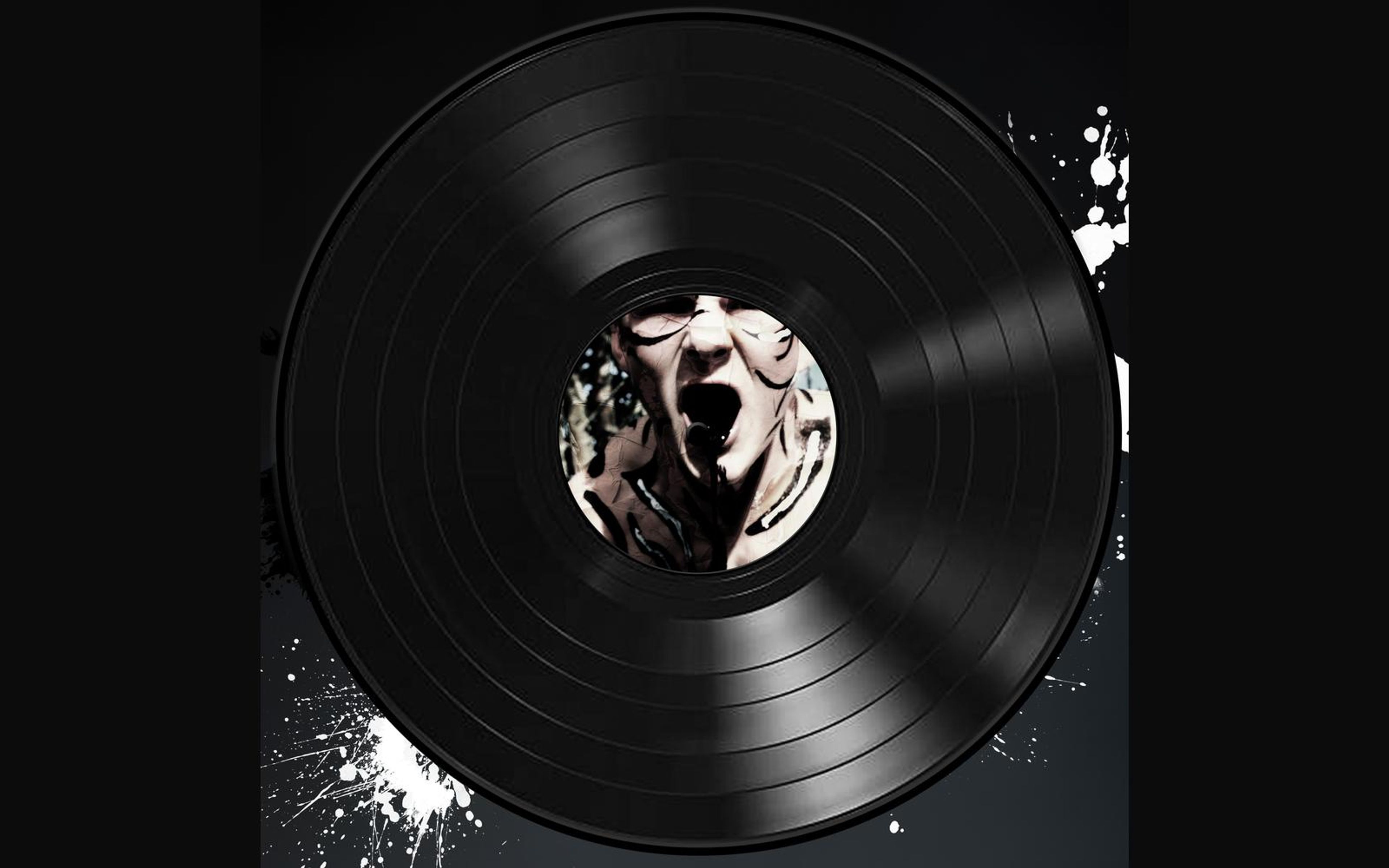 Vinyl record sleeve with a black and white screaming face on the centre label