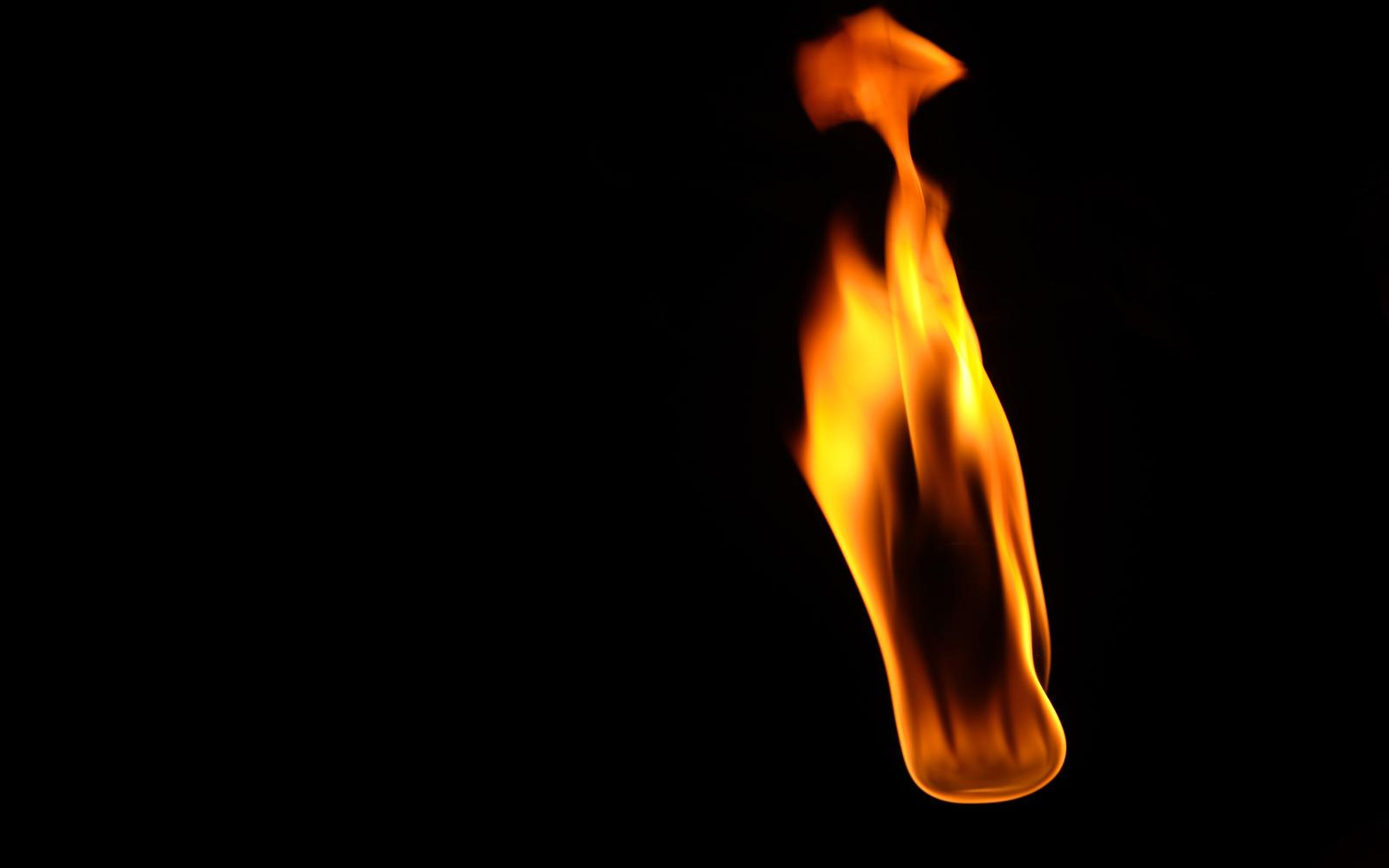 Narrow upright flame with a small lick at the top, right of centre