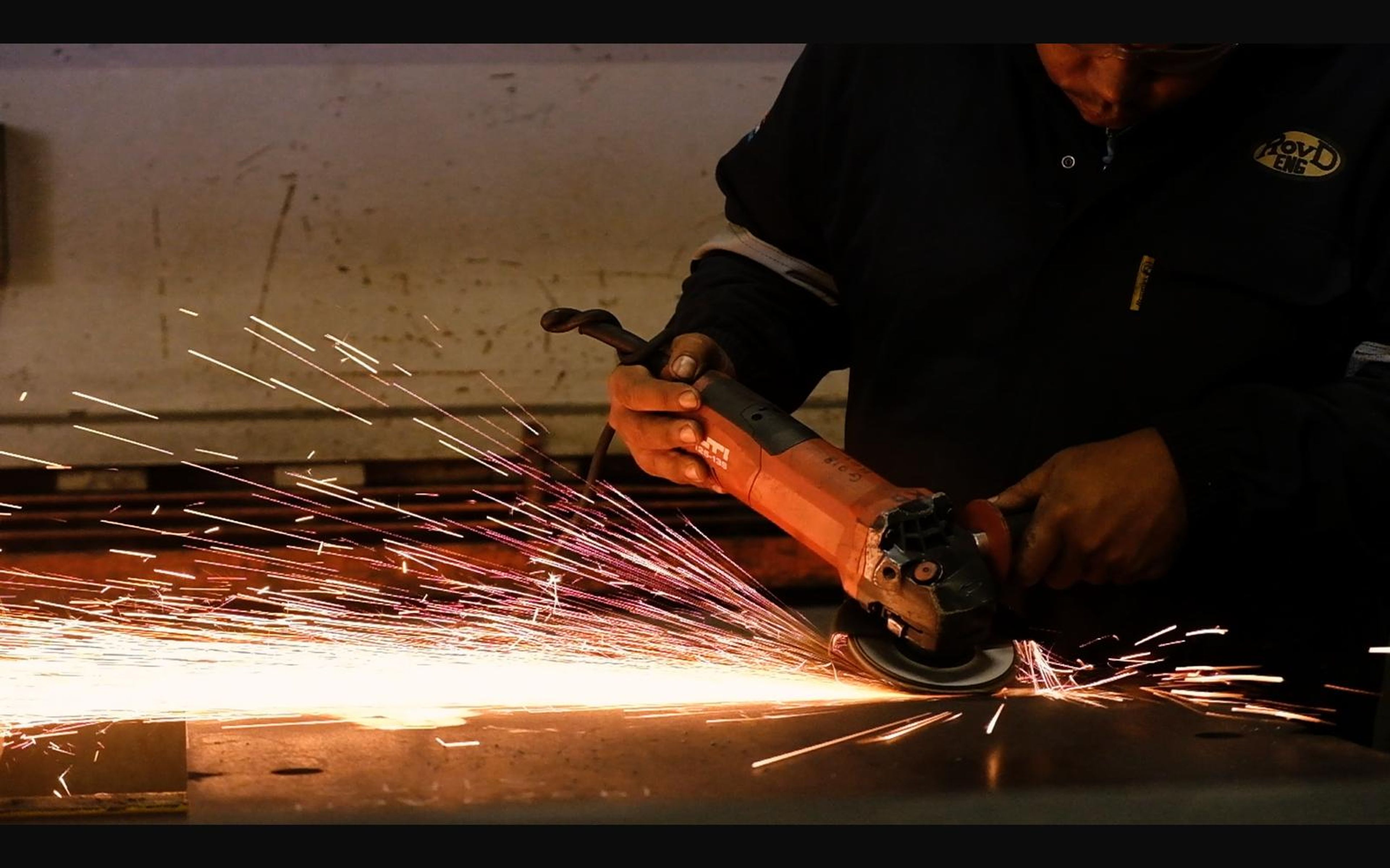 Angle grinder throwing a stream of sparks