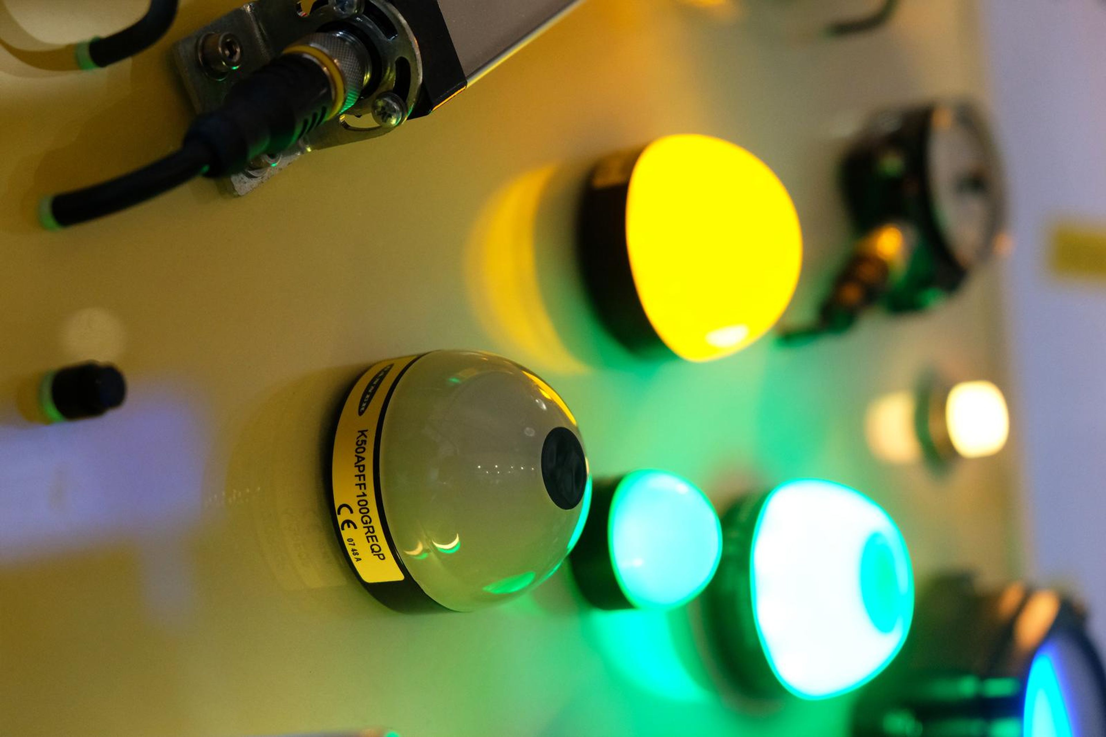 Yellow and green indicator lights on a Turck panel