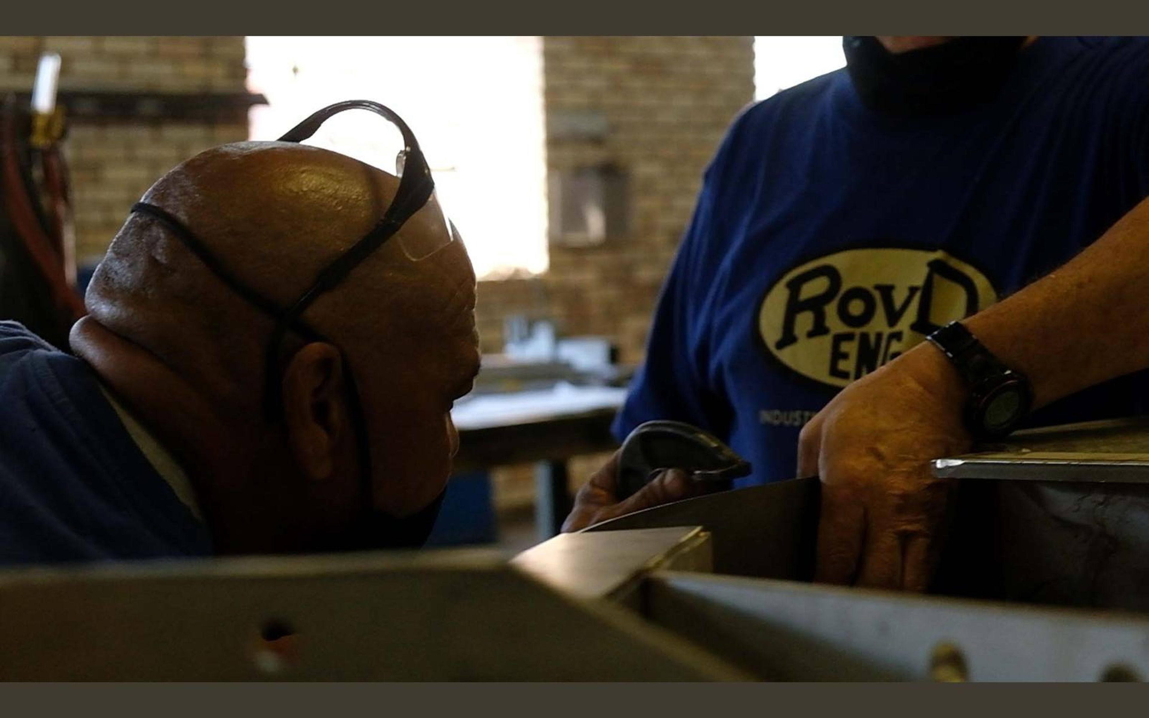Fabricator in a ROVD Engineered to Work shirt at the bench