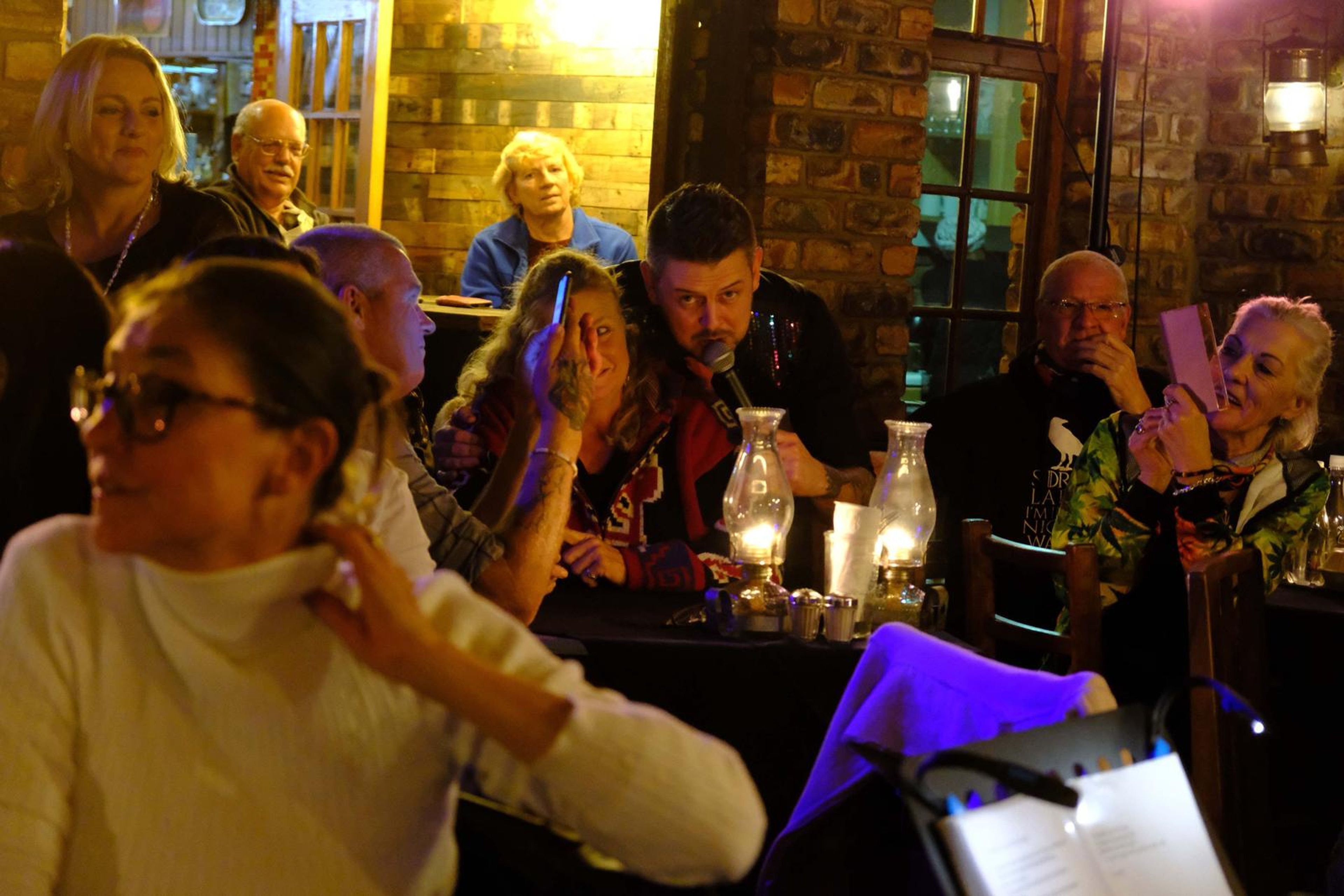 Guests turned to watch the singer working the tables