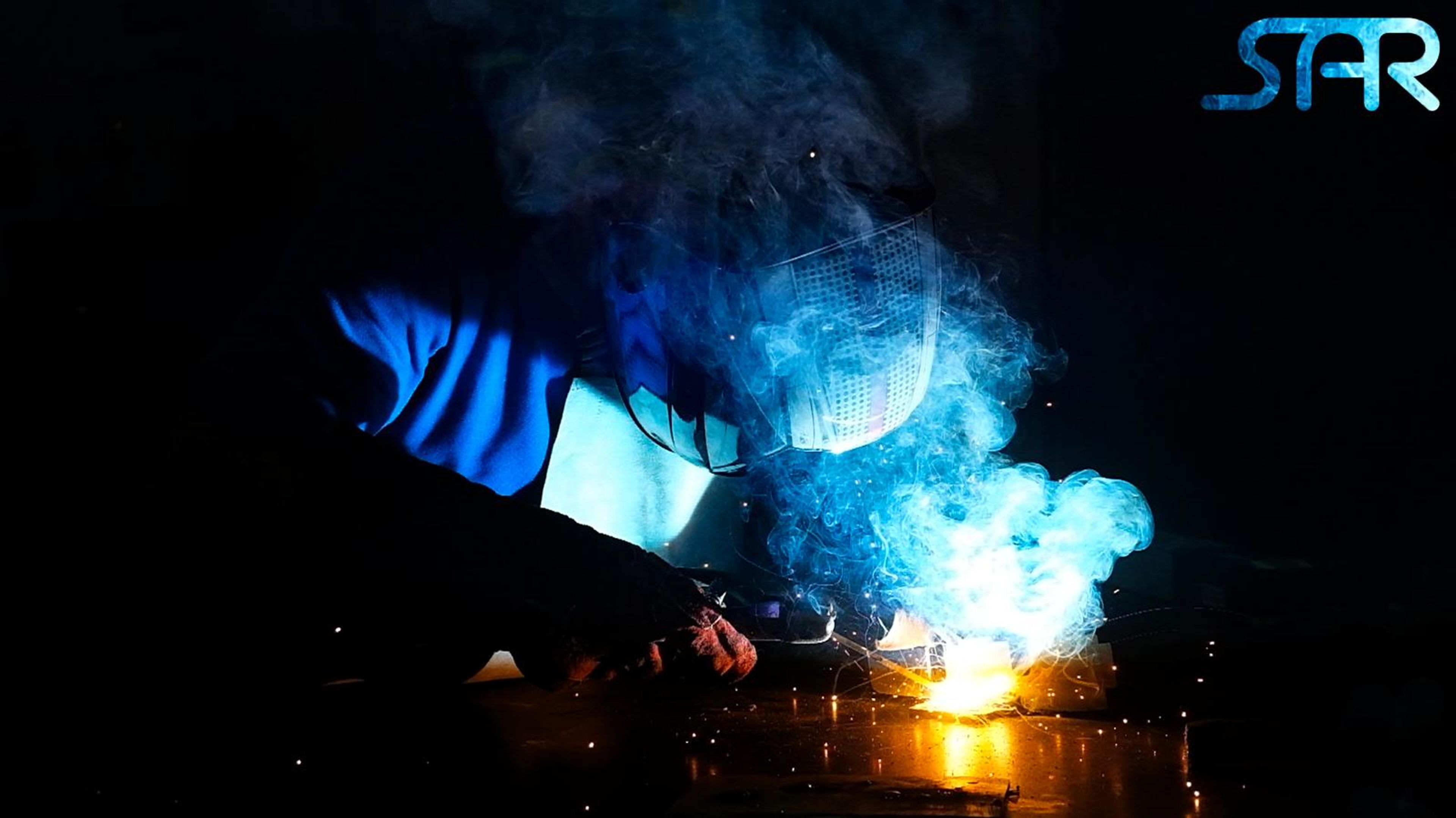 Welding arc on a dark background with the SAR logo in blue at the top right