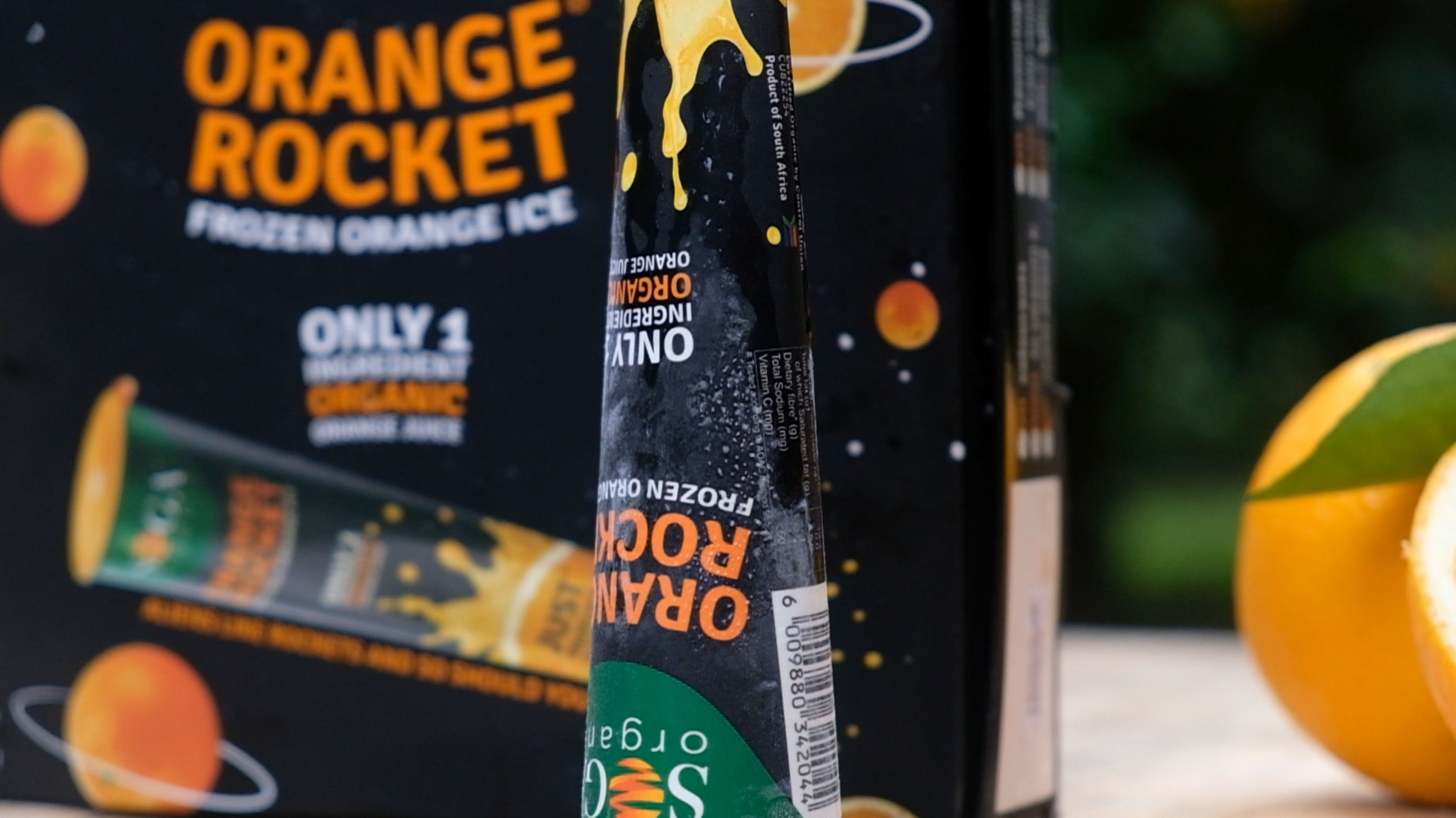 Orange Rocket box and ice tube with an orange in the background