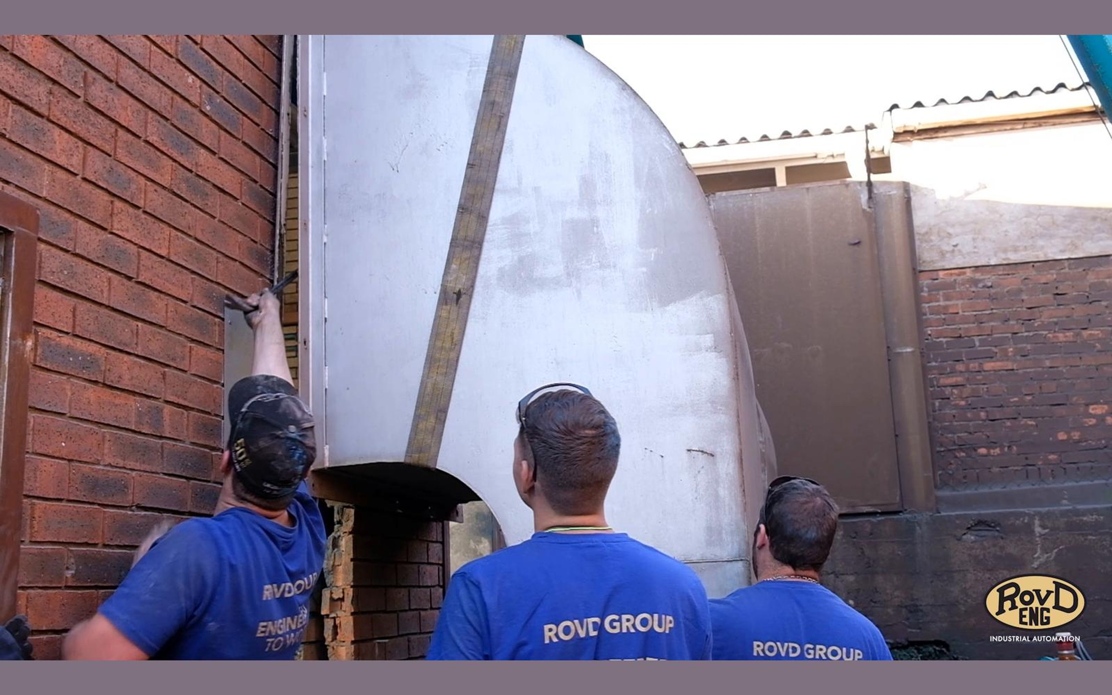 Team fitting large ducting at the paint room