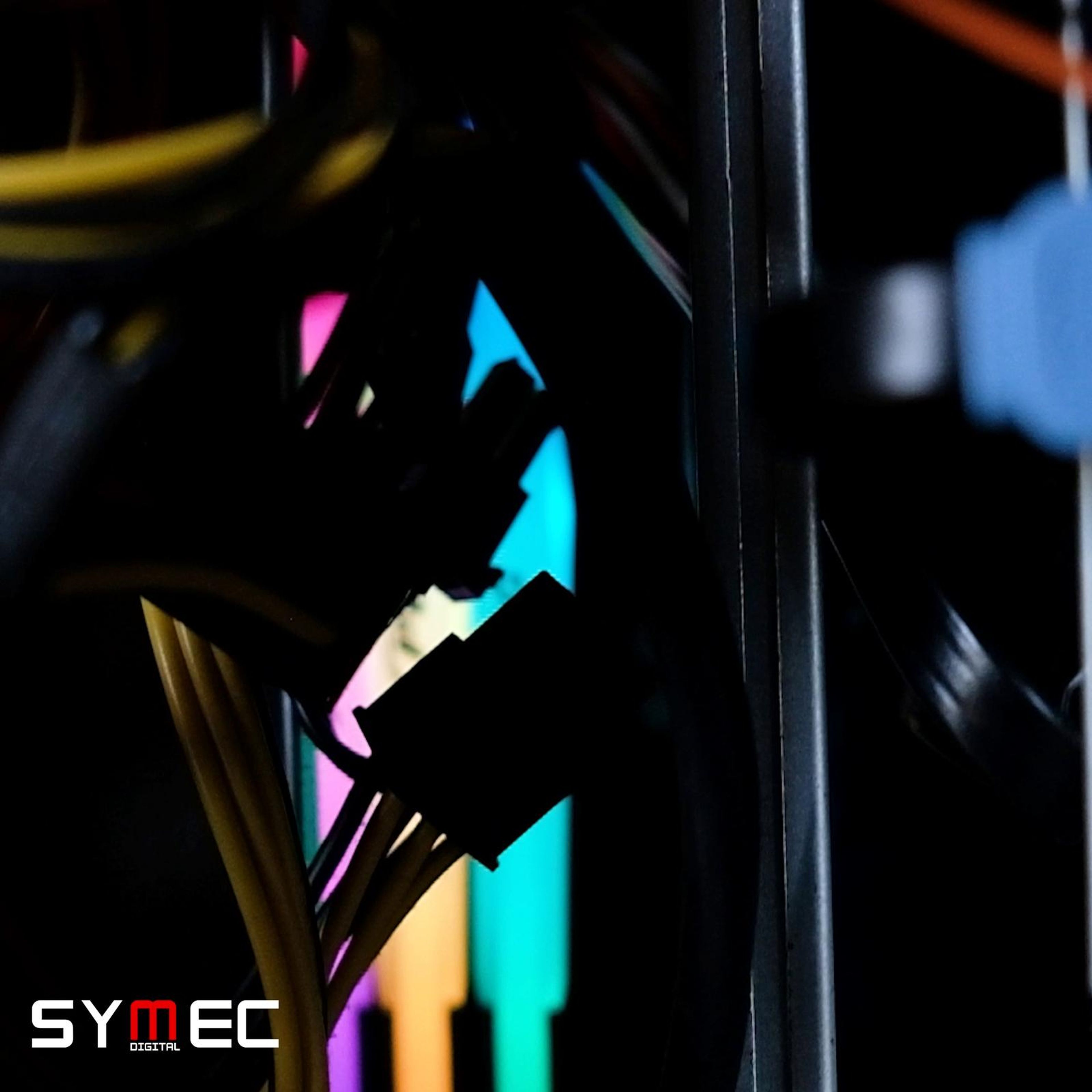 Square cut of neon-lit cables in a machine cabinet