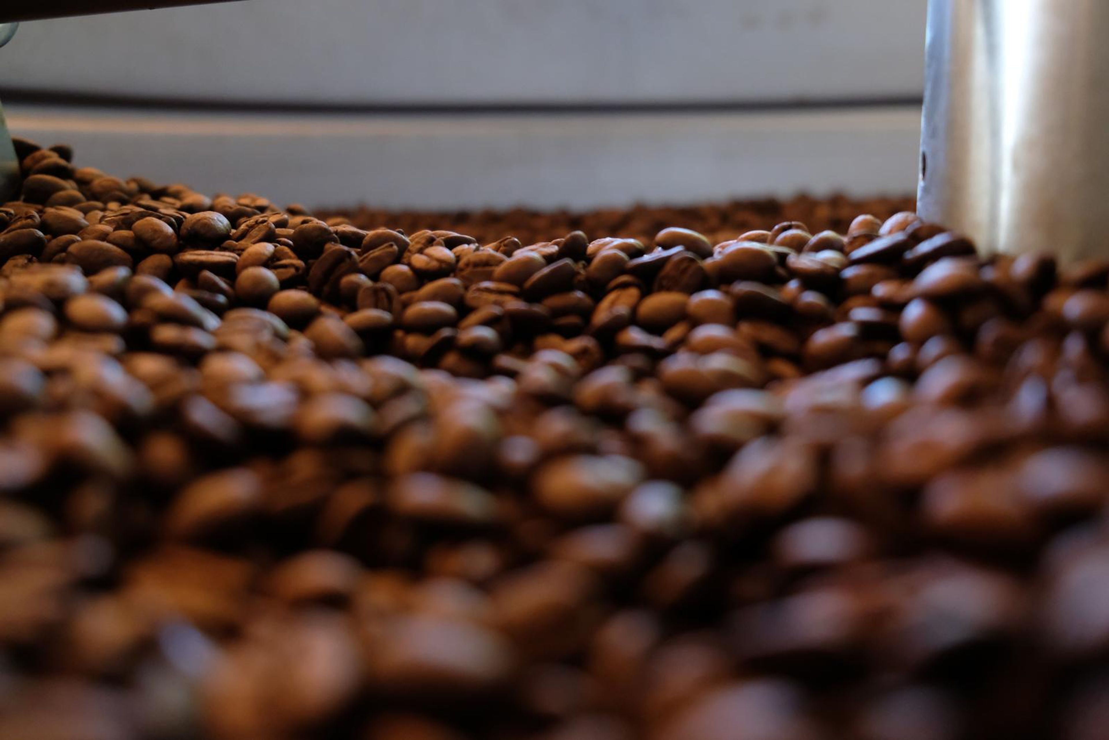 Death By Coffee creative product photography of coffee, beans and branded bags