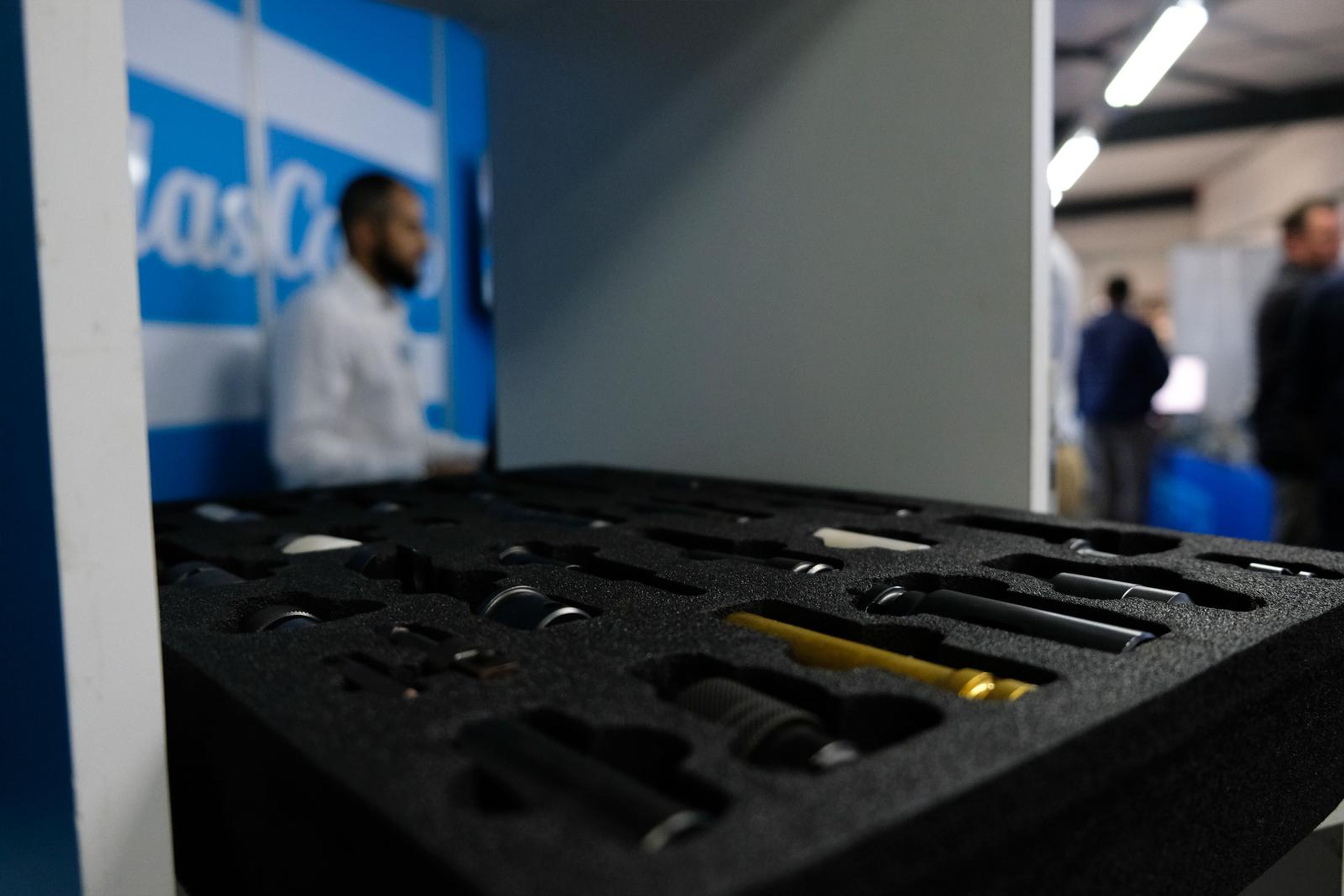 Atlas Copco tool case with a team member at the stand behind