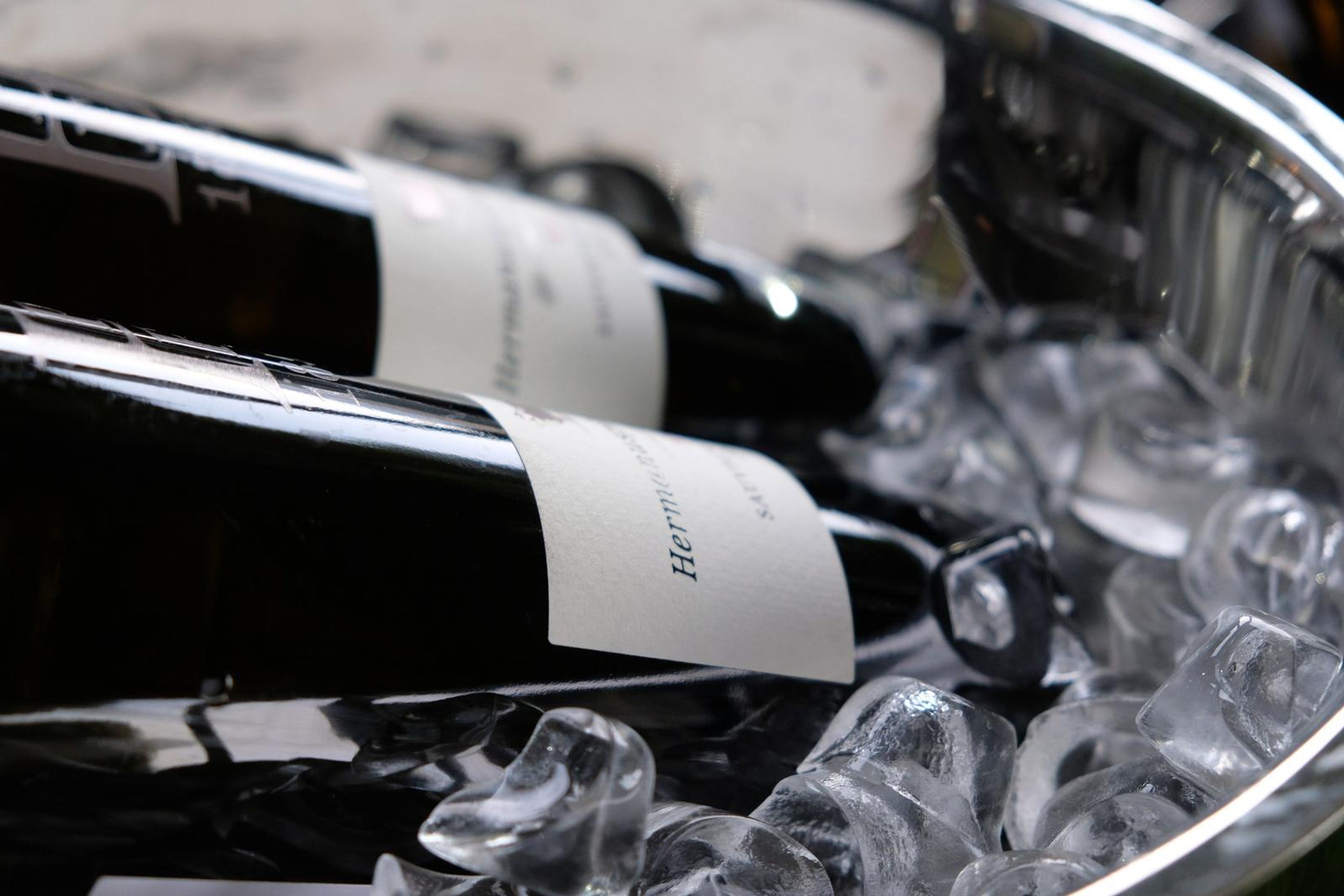 Wine bottle lying in an ice bucket with the label showing