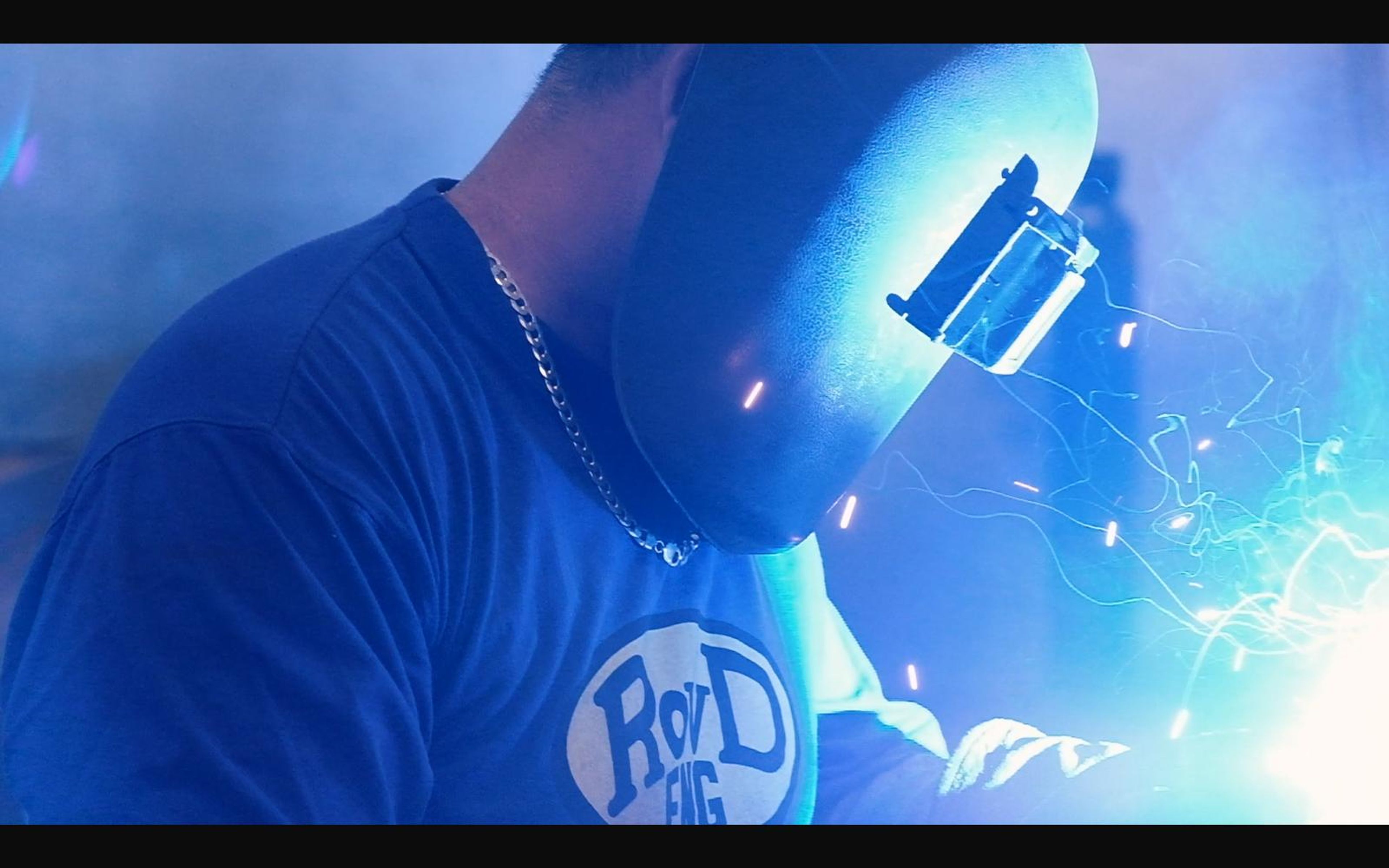 Close view of a welder's mask in blue light