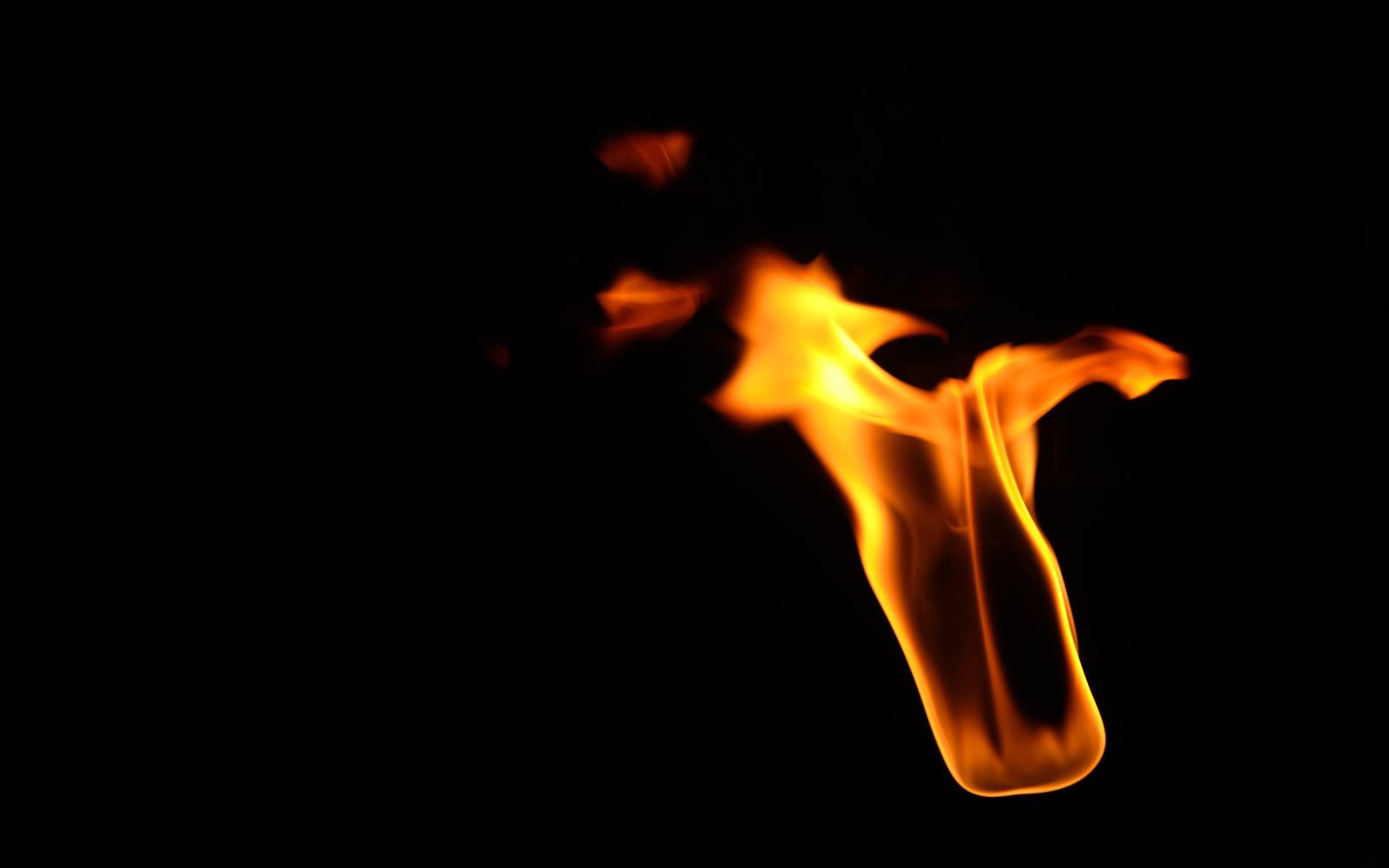 Flame with scattered sparks above and a flick toward the right