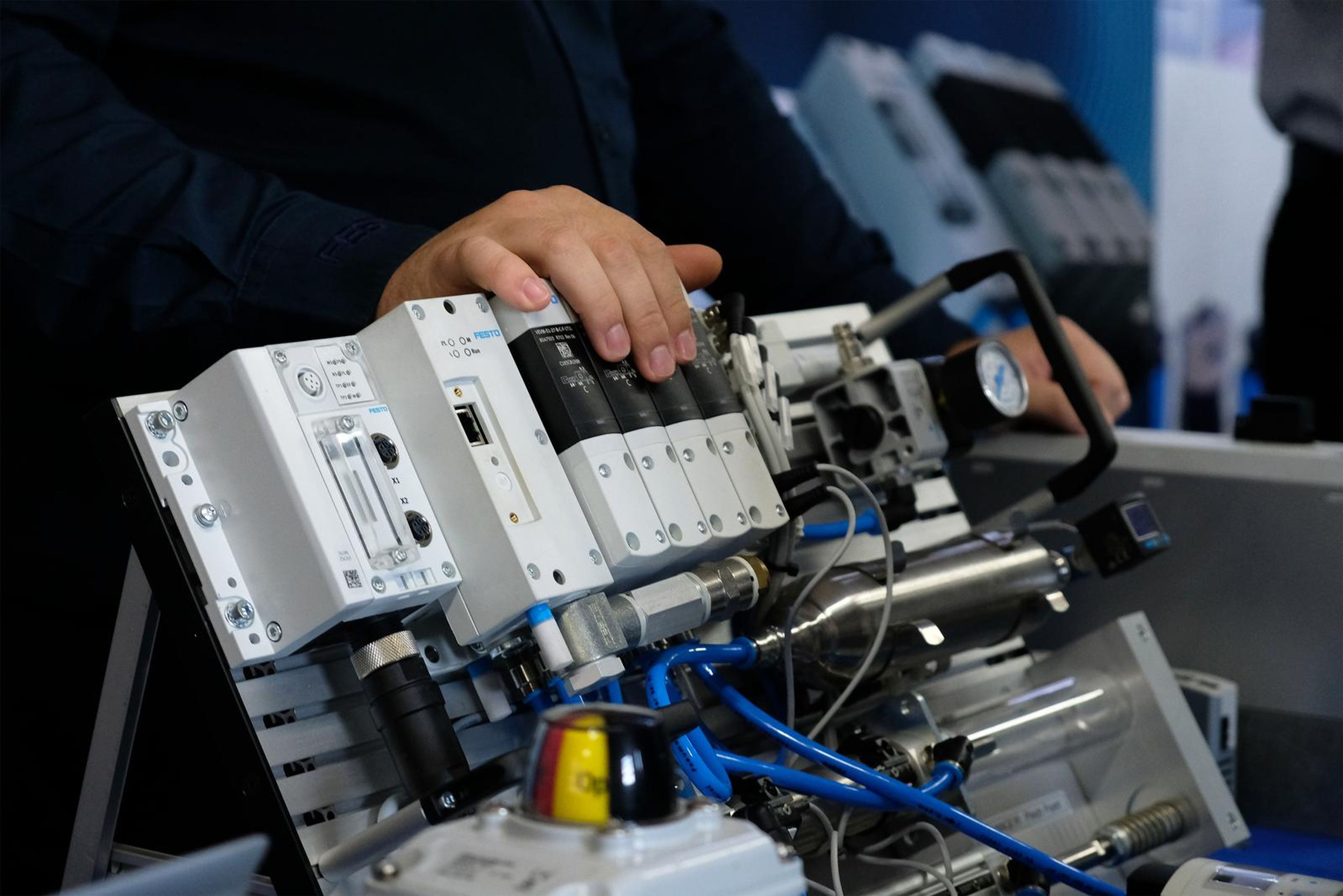 Hands working on a Festo pneumatic demonstration