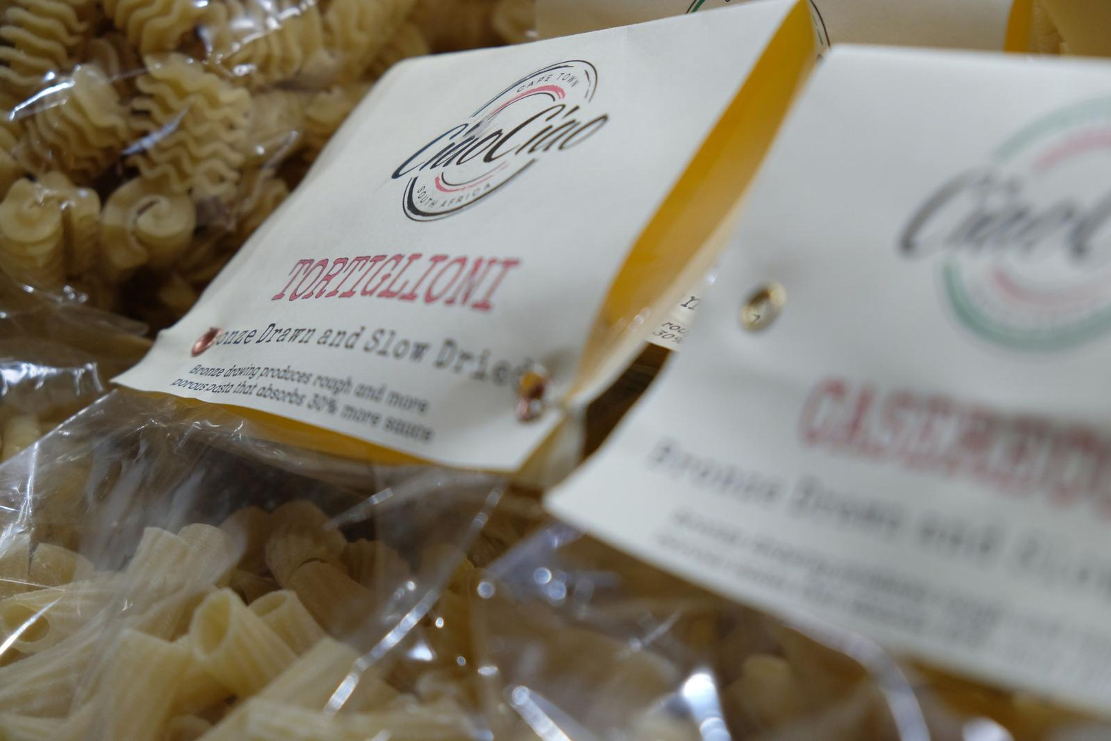 Bags of CiaoCiao pasta stacked on the shelf