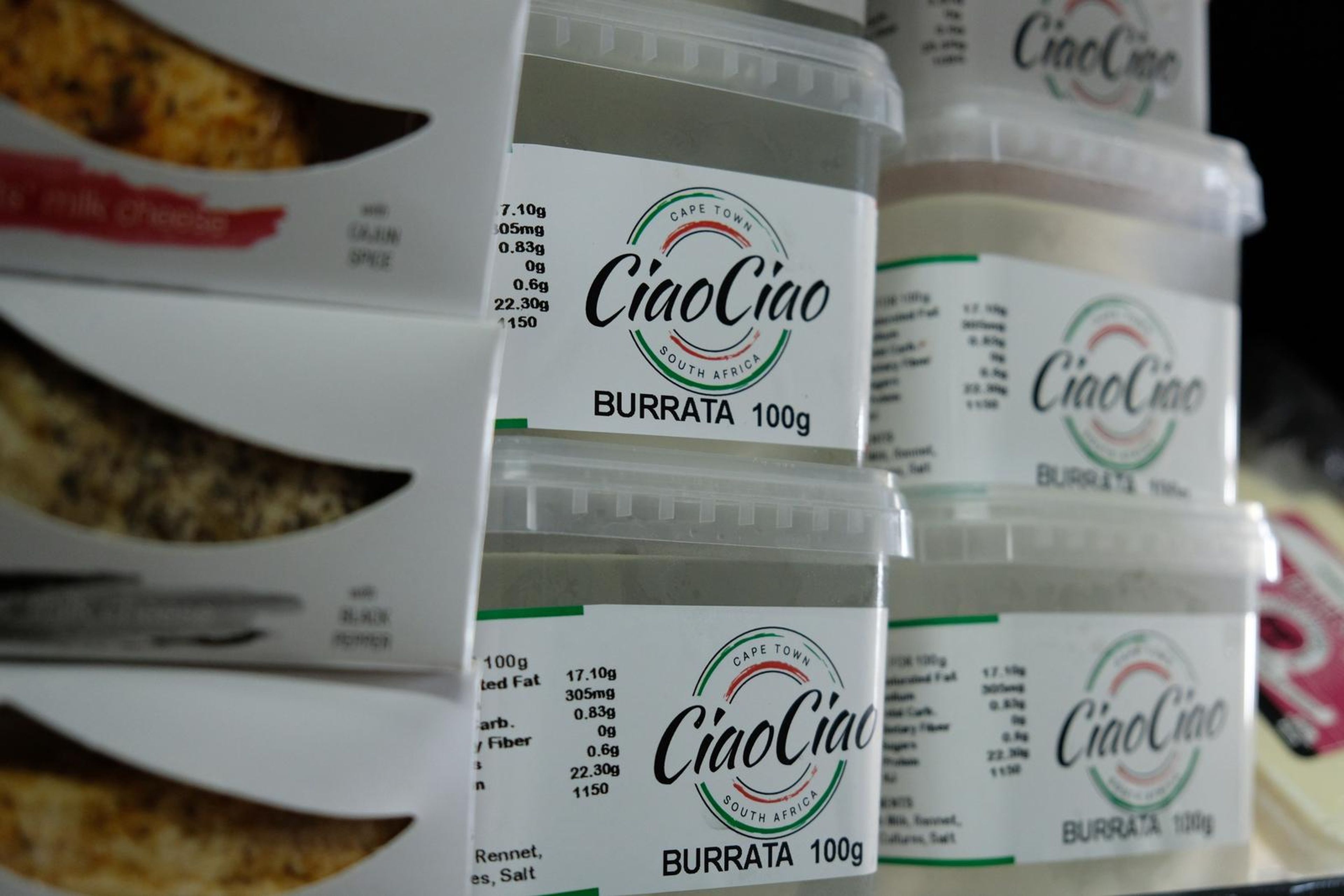 Tubs of CiaoCiao burrata stacked in the fridge