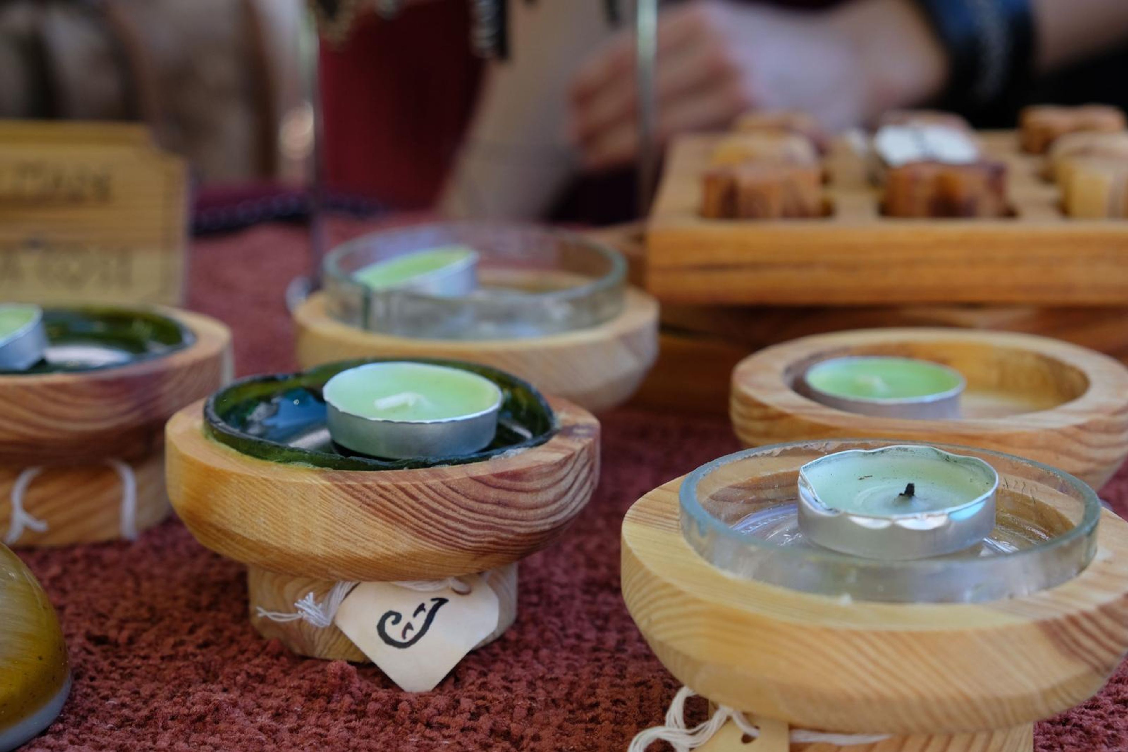 Hand-carved wooden candle holders and a wooden game at the Juuks stall
