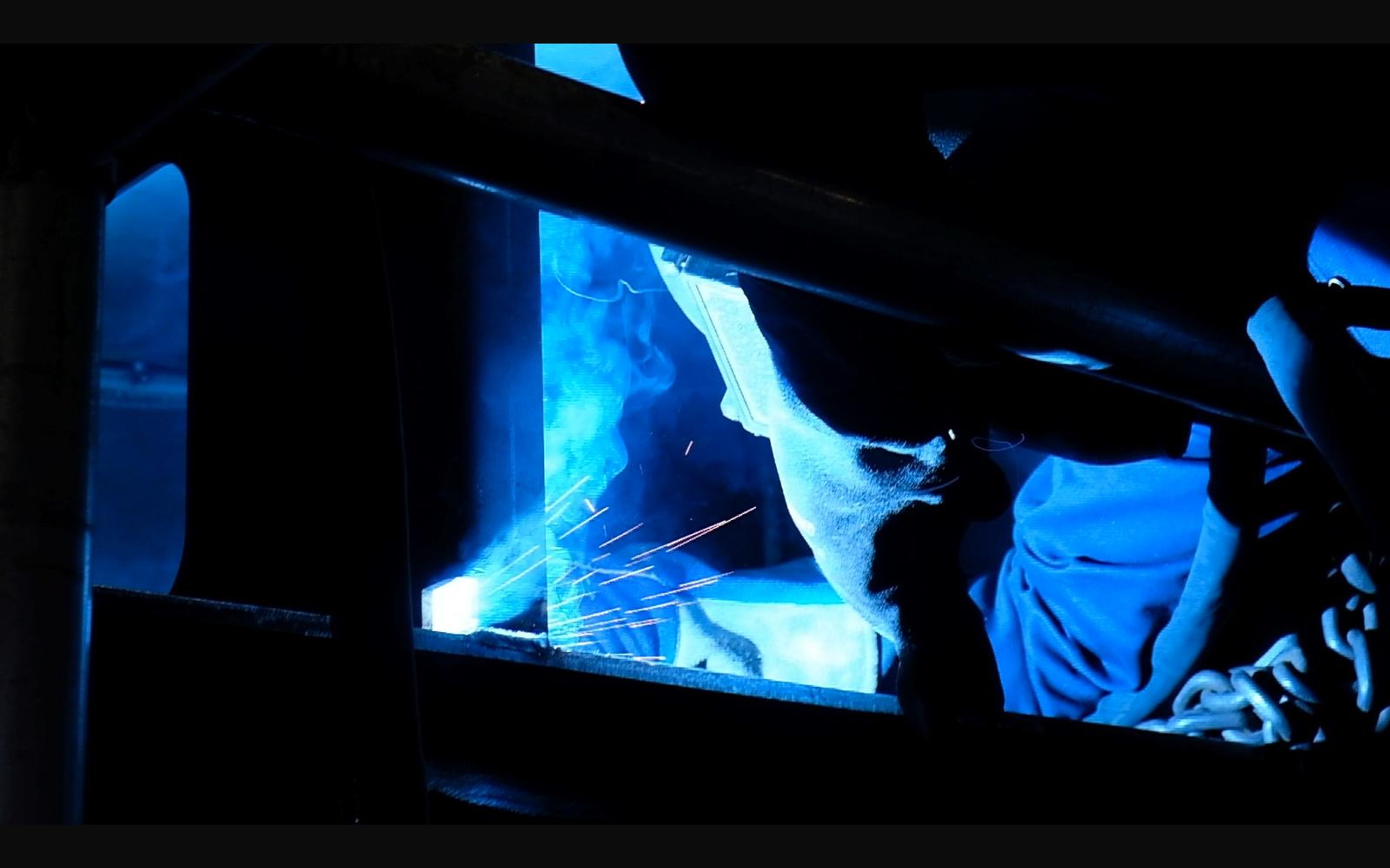 Welding glow through an opening in a steel frame
