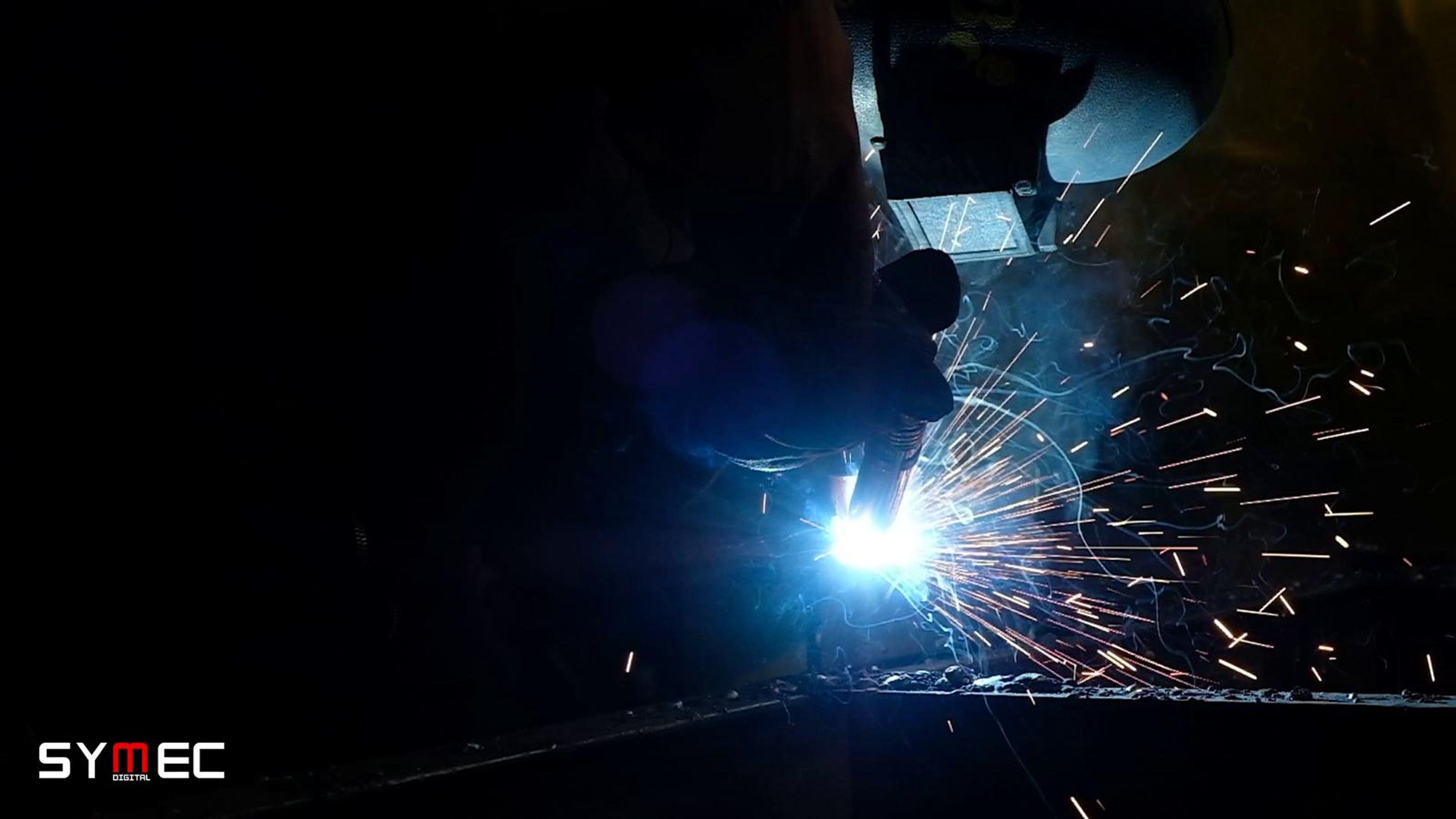 Welding arc lighting a welder in the dark