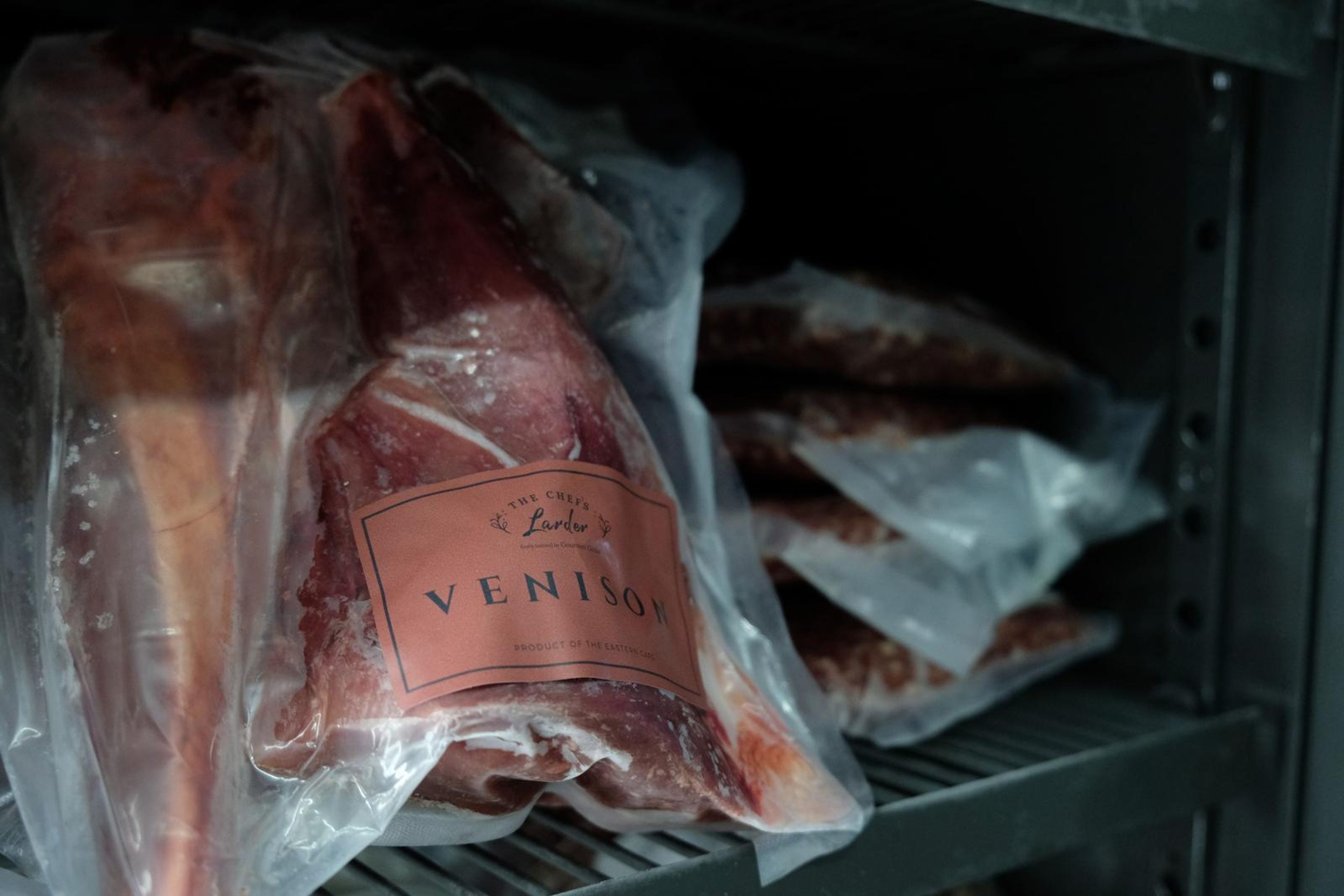 Vacuum-packed venison leg in the butchery fridge