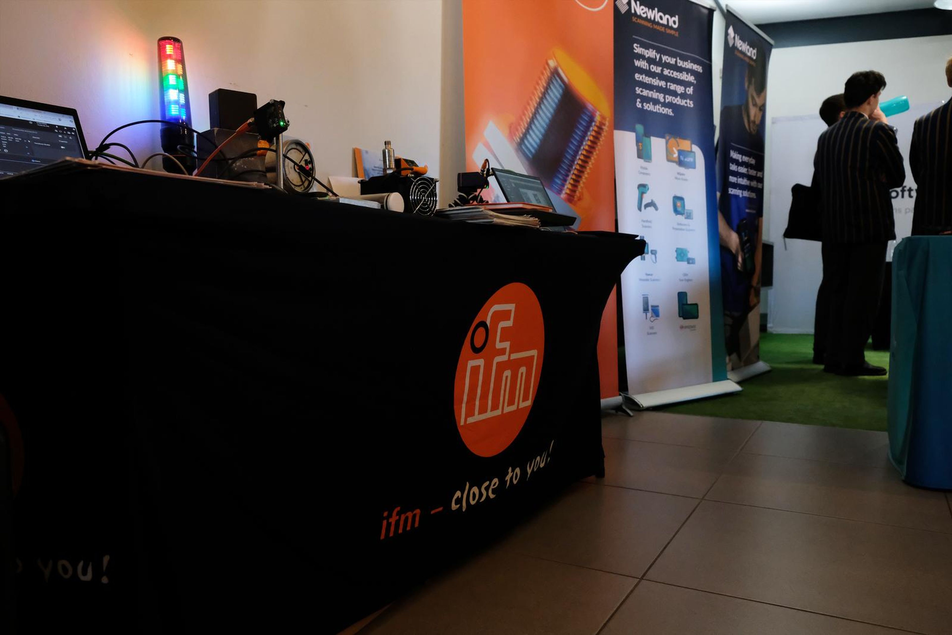 IFM branded stand table with its logo