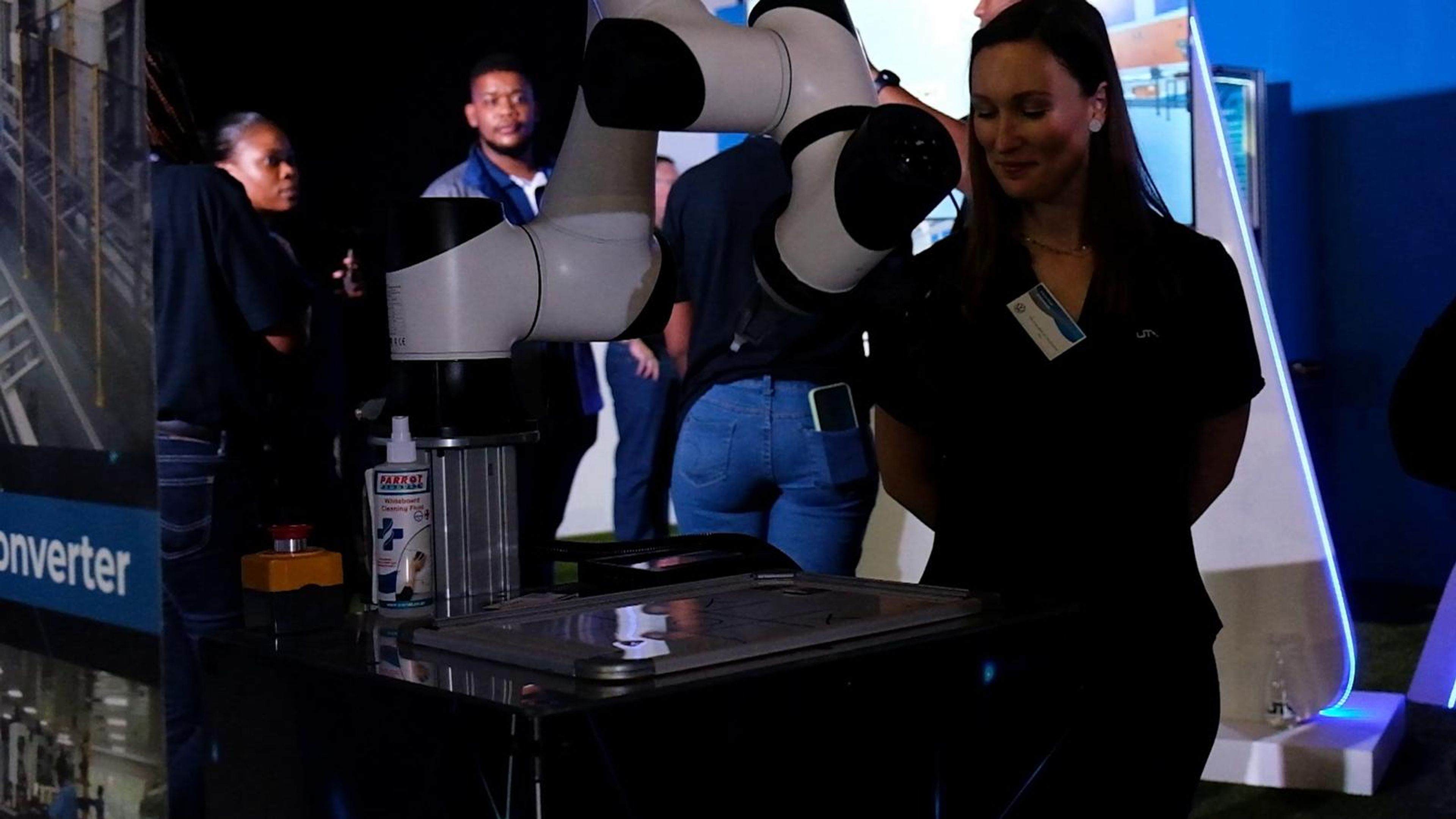 Visitors watching a collaborative robot demonstration