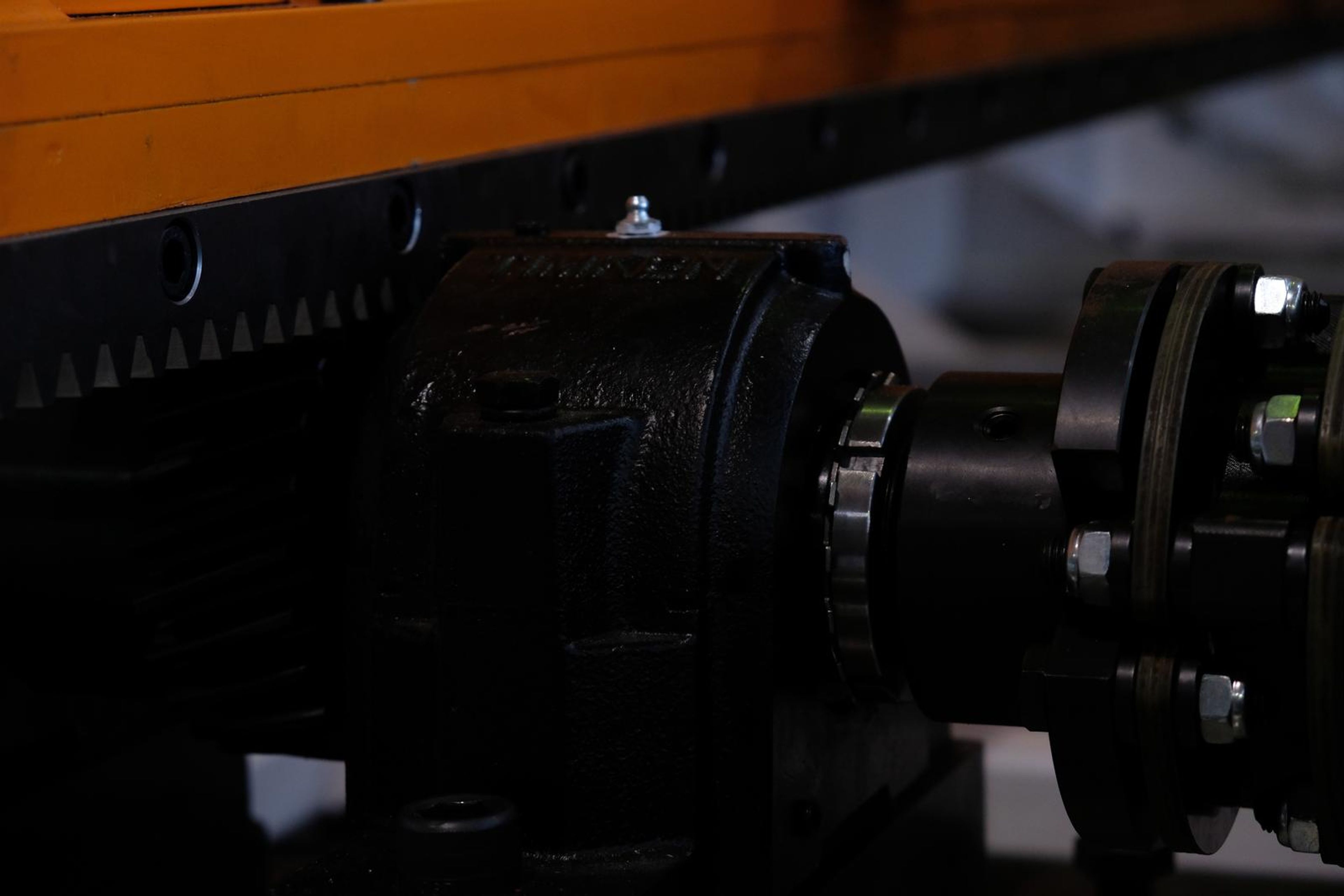 Black bearing housing and rack beneath the tool