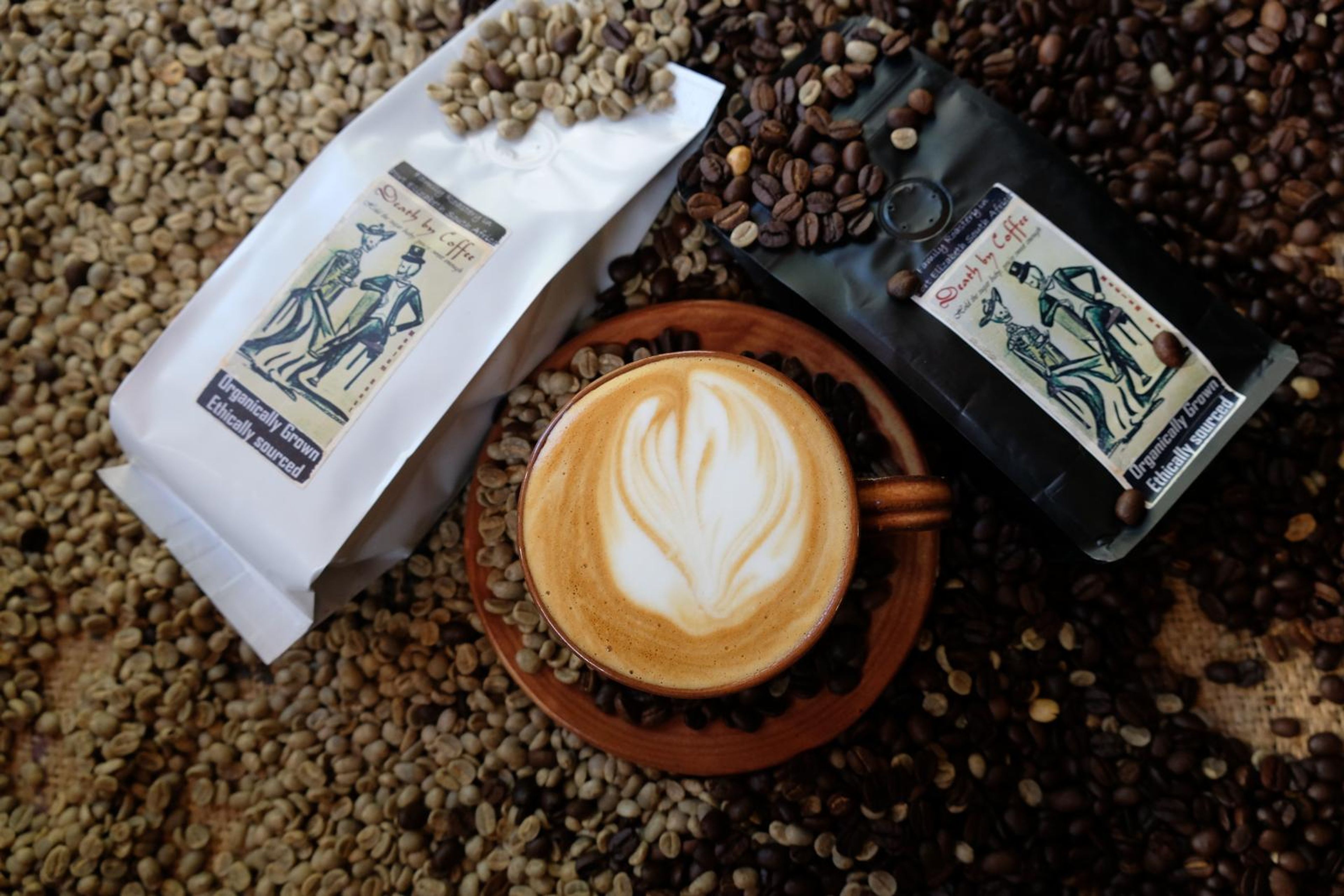 Death By Coffee creative product photography of coffee, beans and branded bags