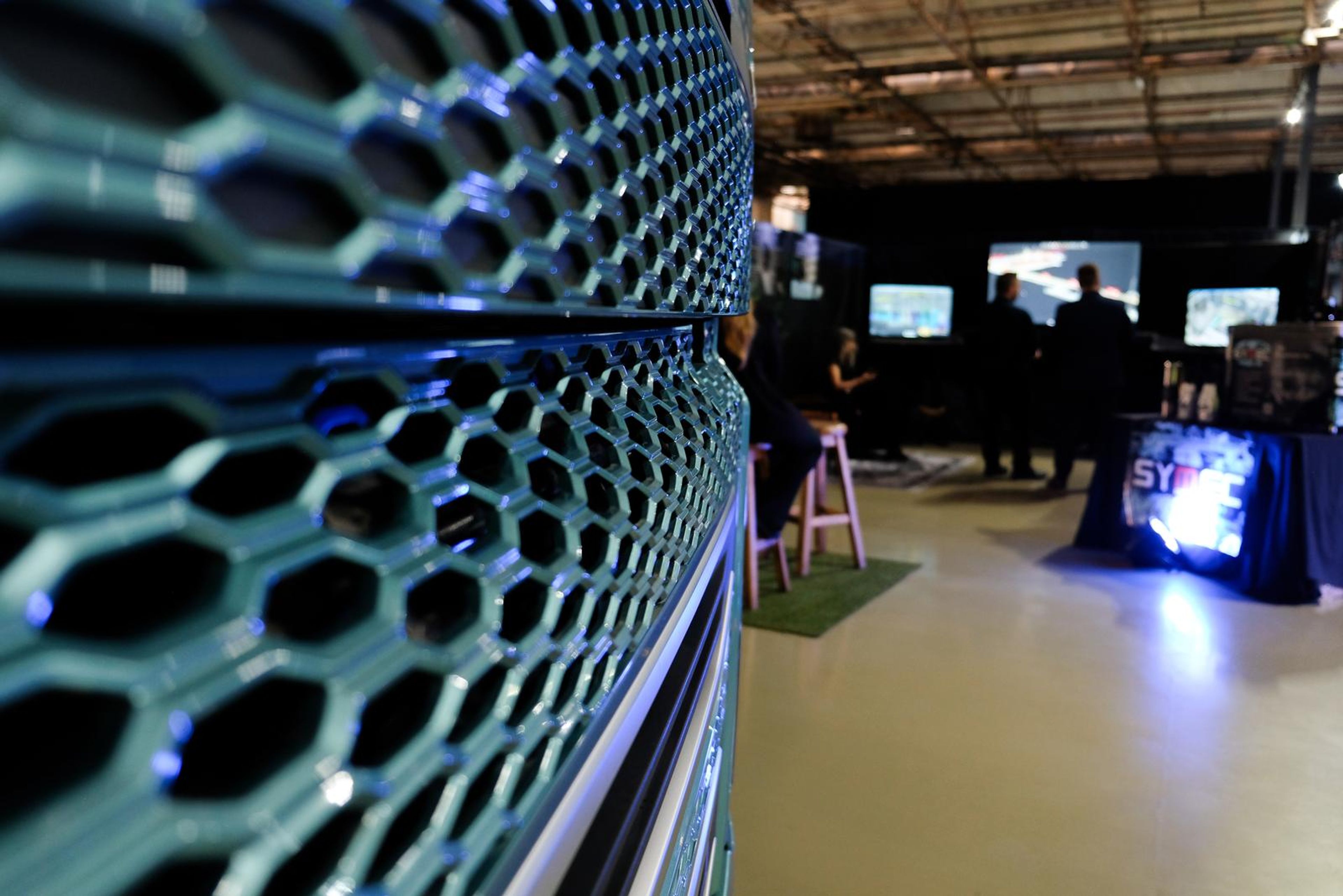 Hexagonal mesh in the foreground with the Symec stall beyond