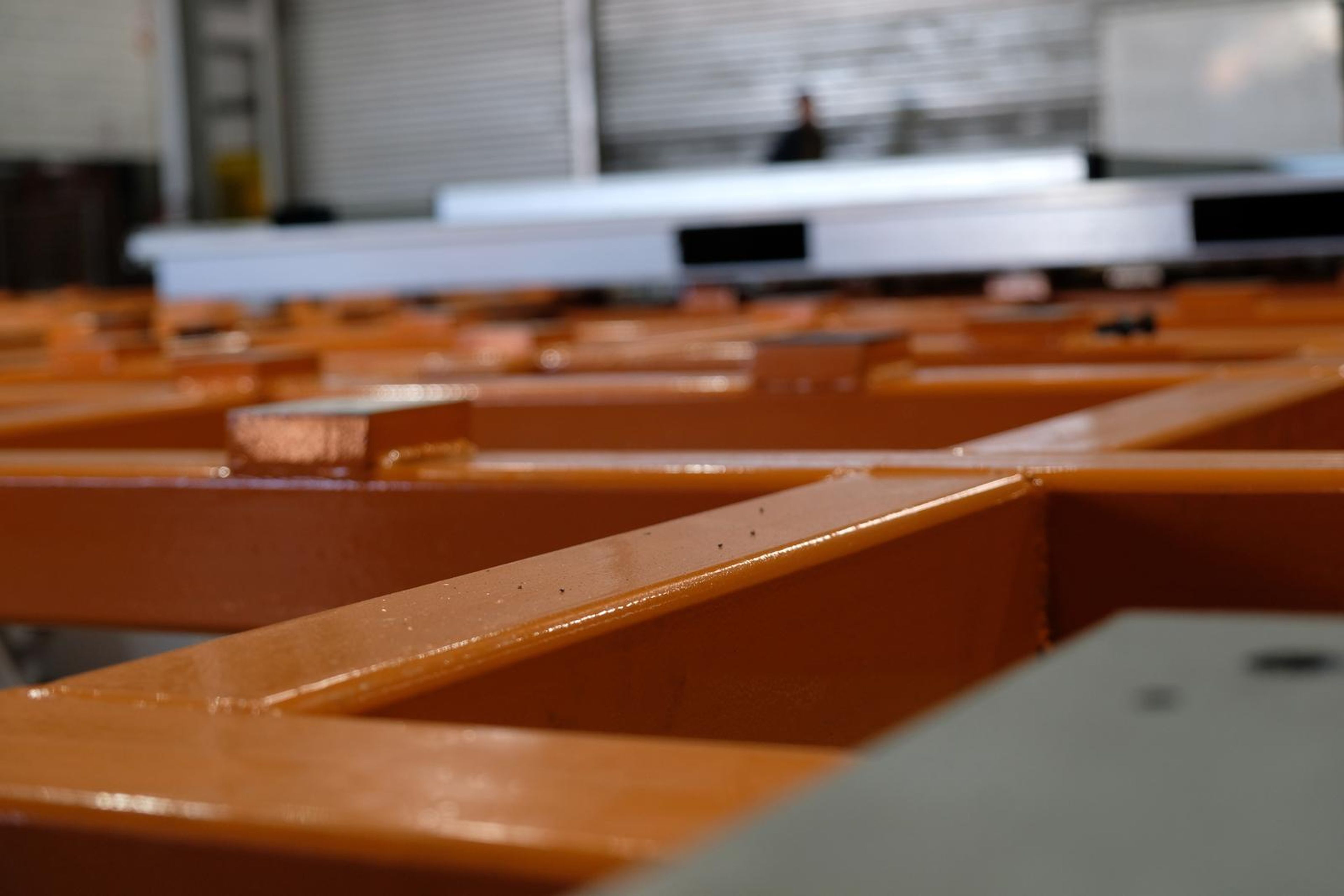 Orange lattice frame with copper-coloured plates