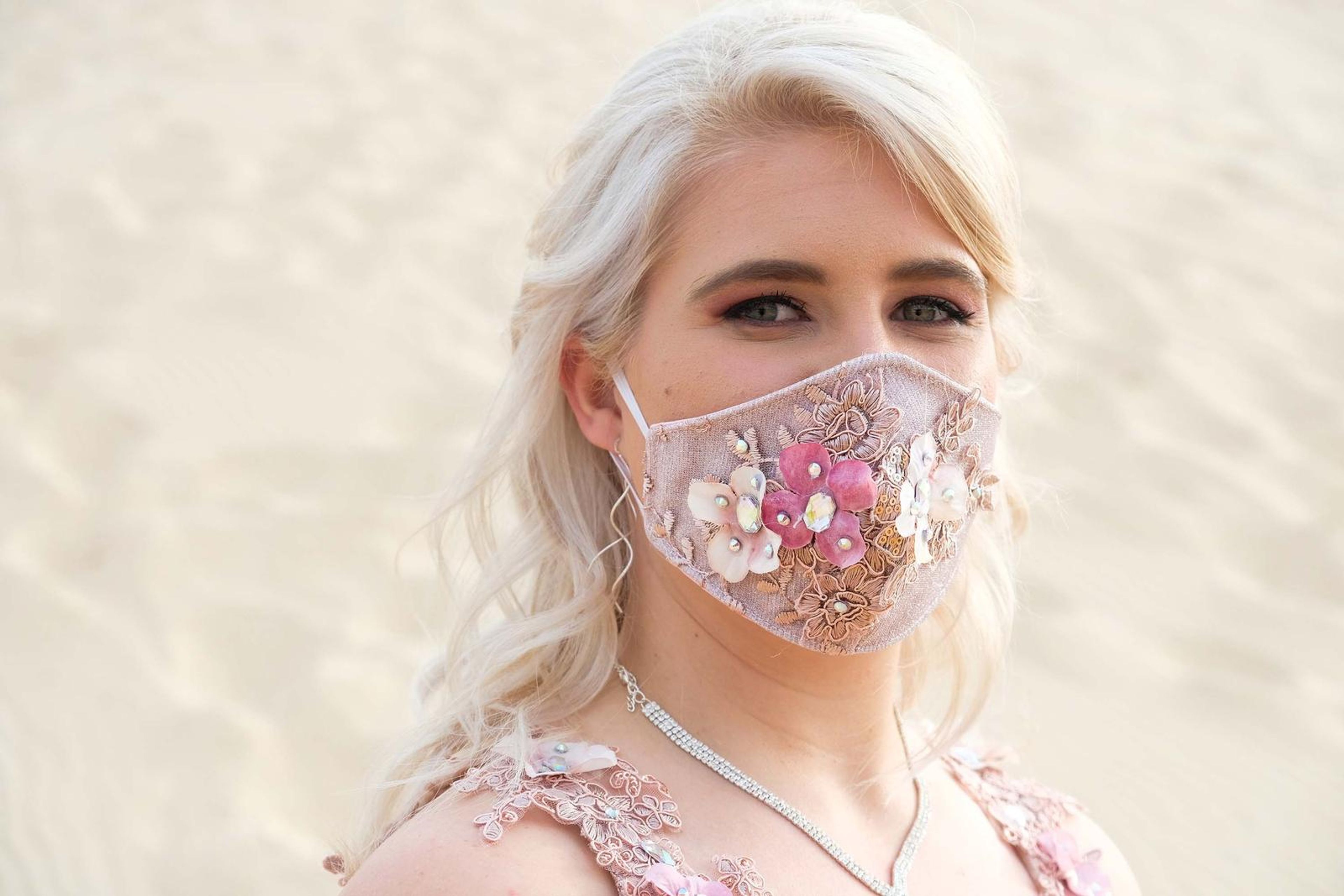 Portrait wearing a decorative floral face mask