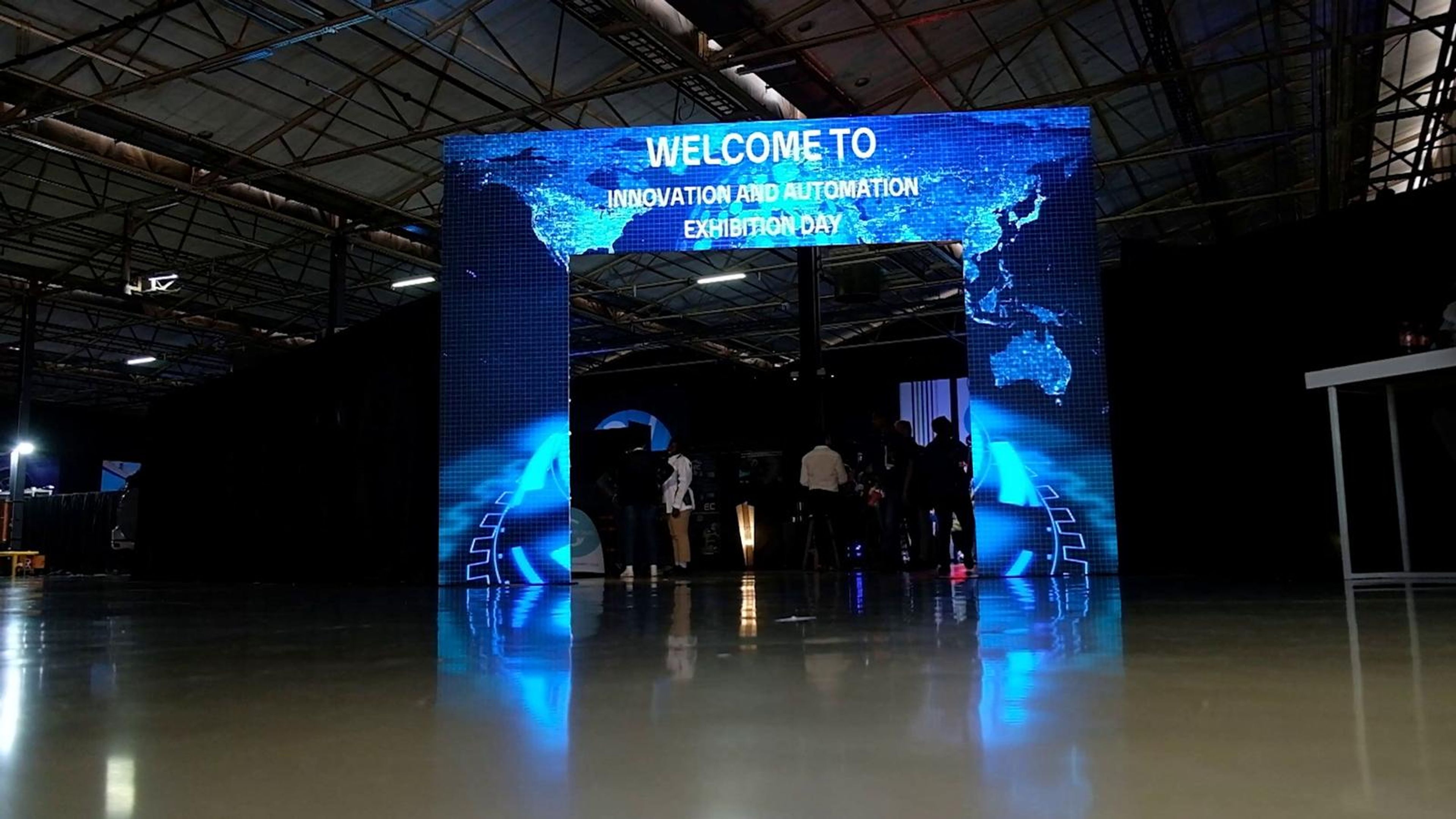 Volkswagen electric SUV on display under a bright light in the expo hall