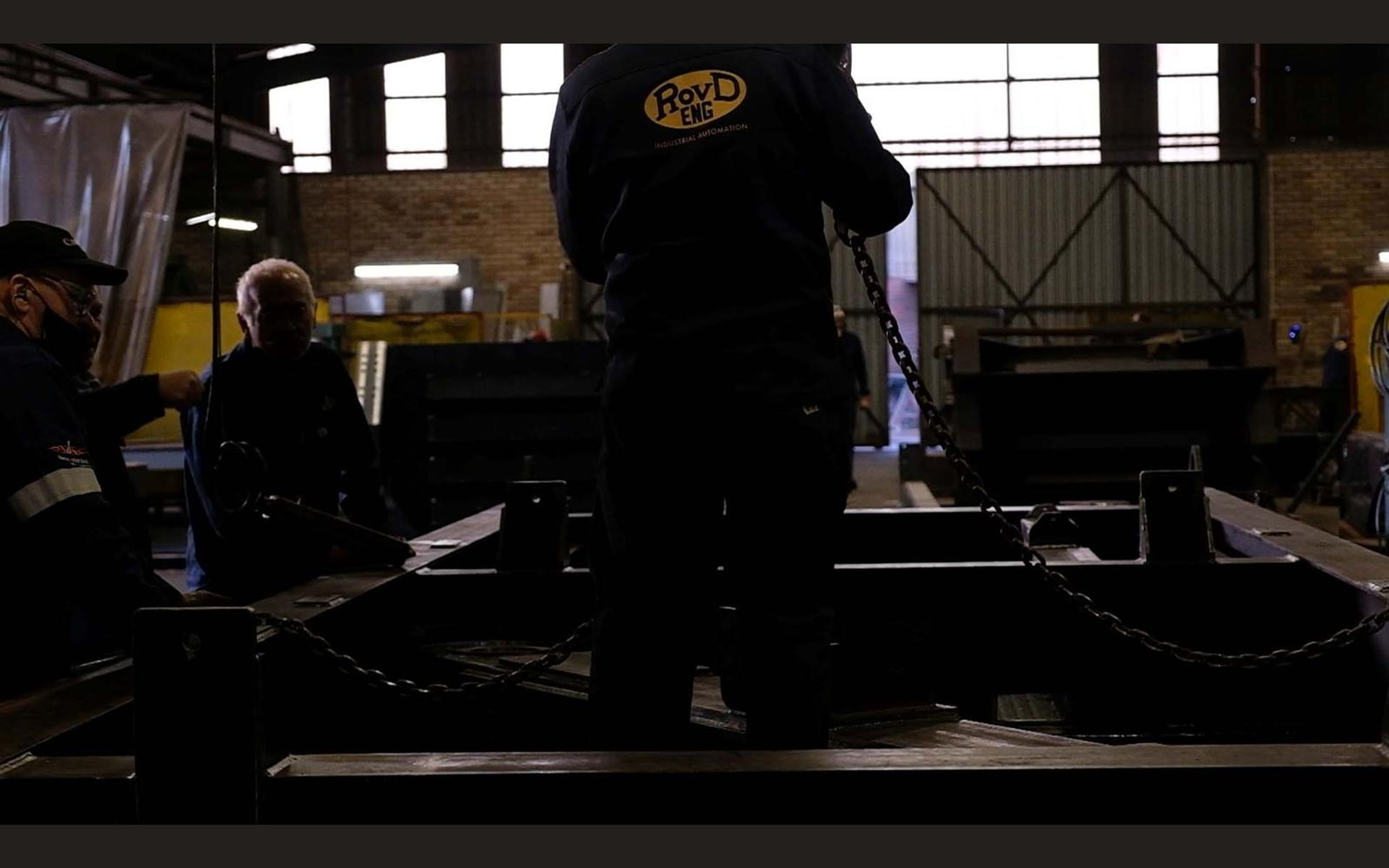 Wide view of the fabrication sector with steel frames on the floor