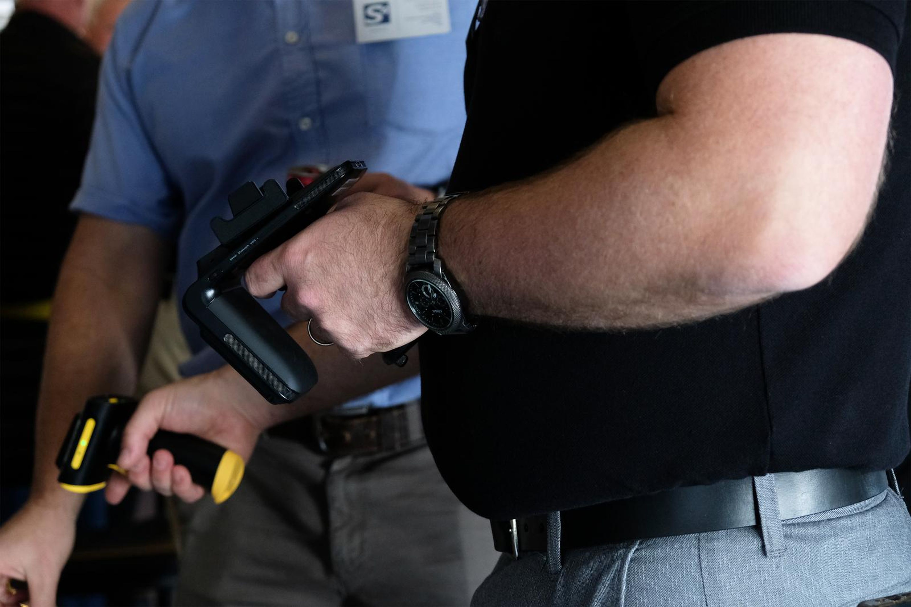 Visitor holding a handheld scanner