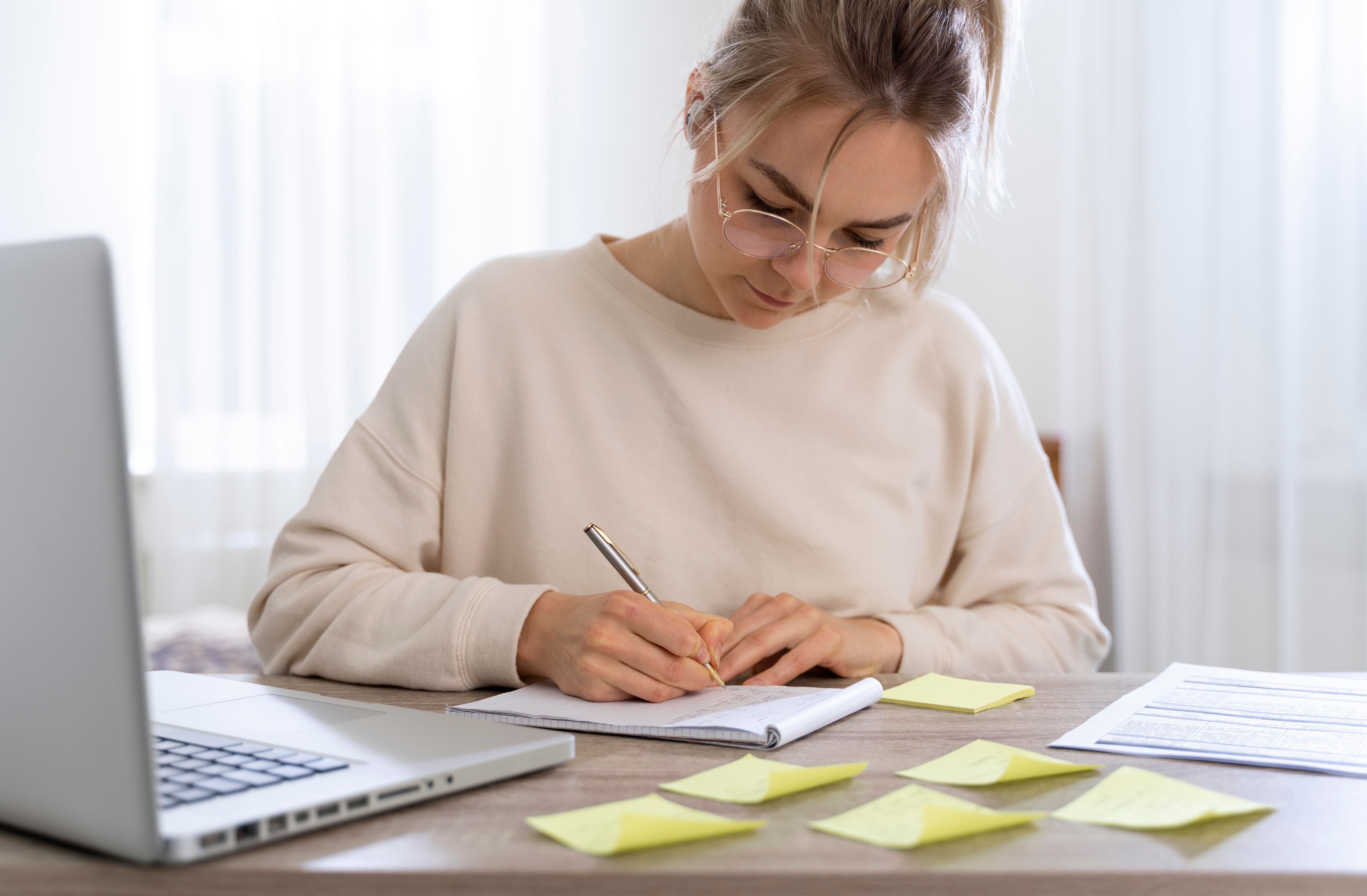 Female student writing notes