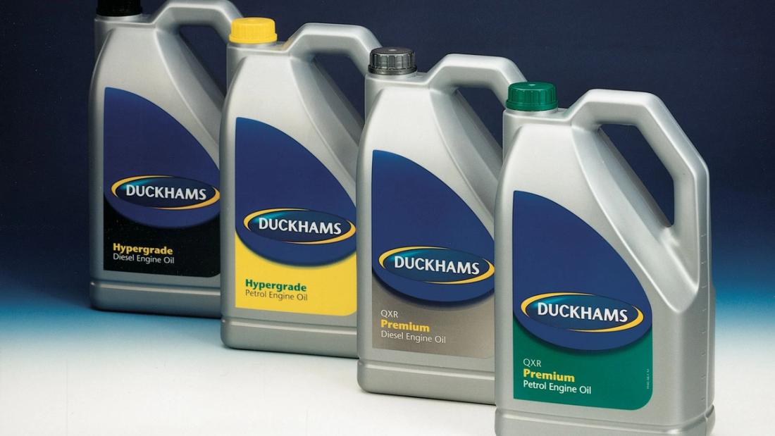Four Duckhams bottles in the blue-panelled shelf livery, Hypergrade and Premium grades.