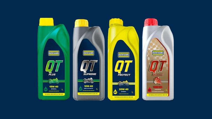Four Duckhams QT motorcycle oil bottles: QT Plus, QT Supreme, QT Protect and QT S.