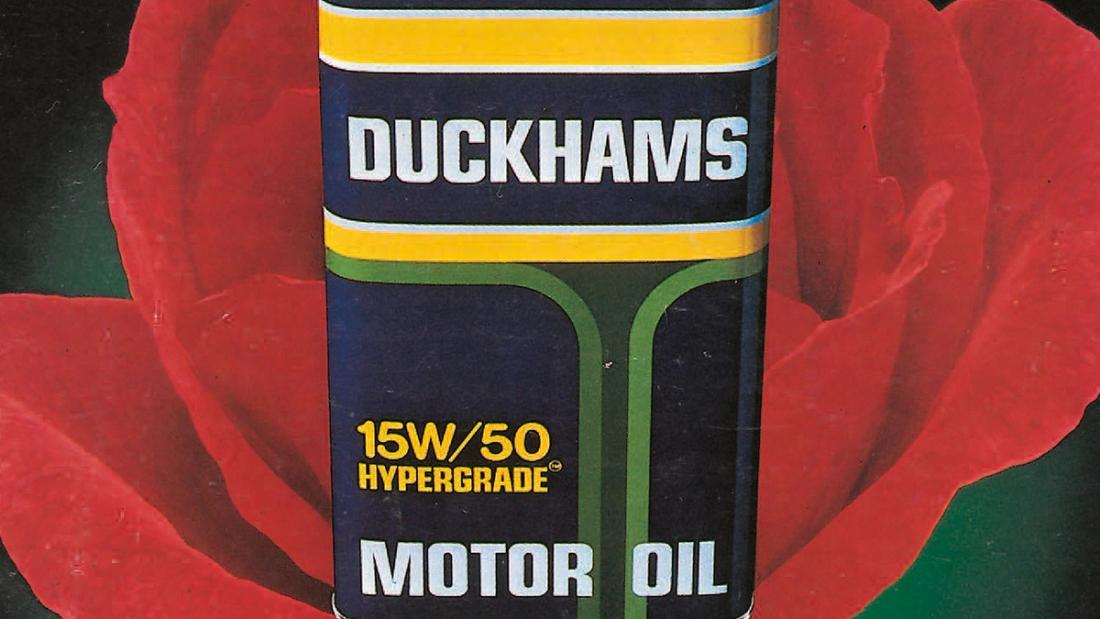 A Duckhams Hypergrade 15W/50 motor oil can photographed against a red rose.