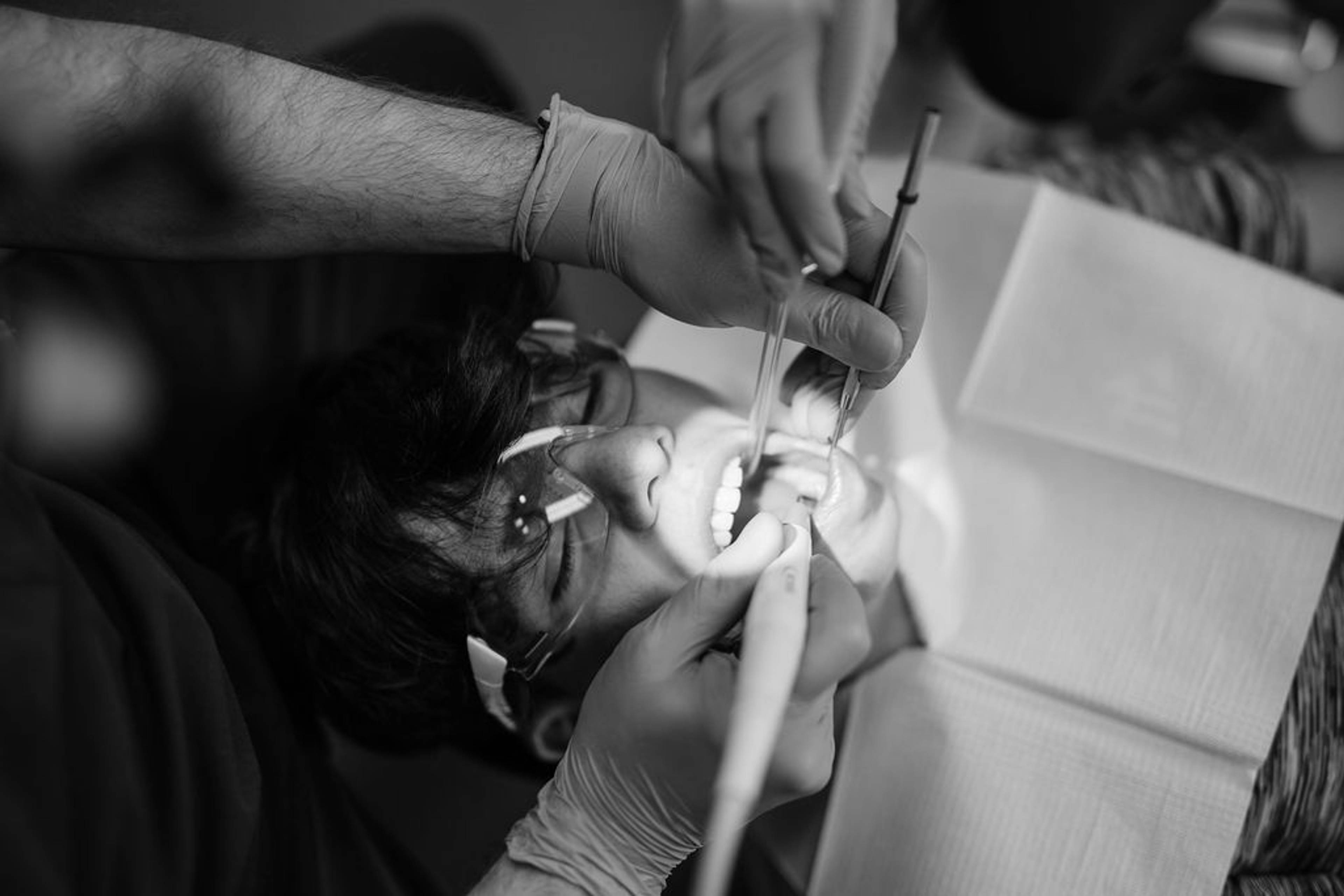 Patient receiving professional general dentistry treatment using specialised dental instruments during a routine dental examination at Pontesbury Dental.