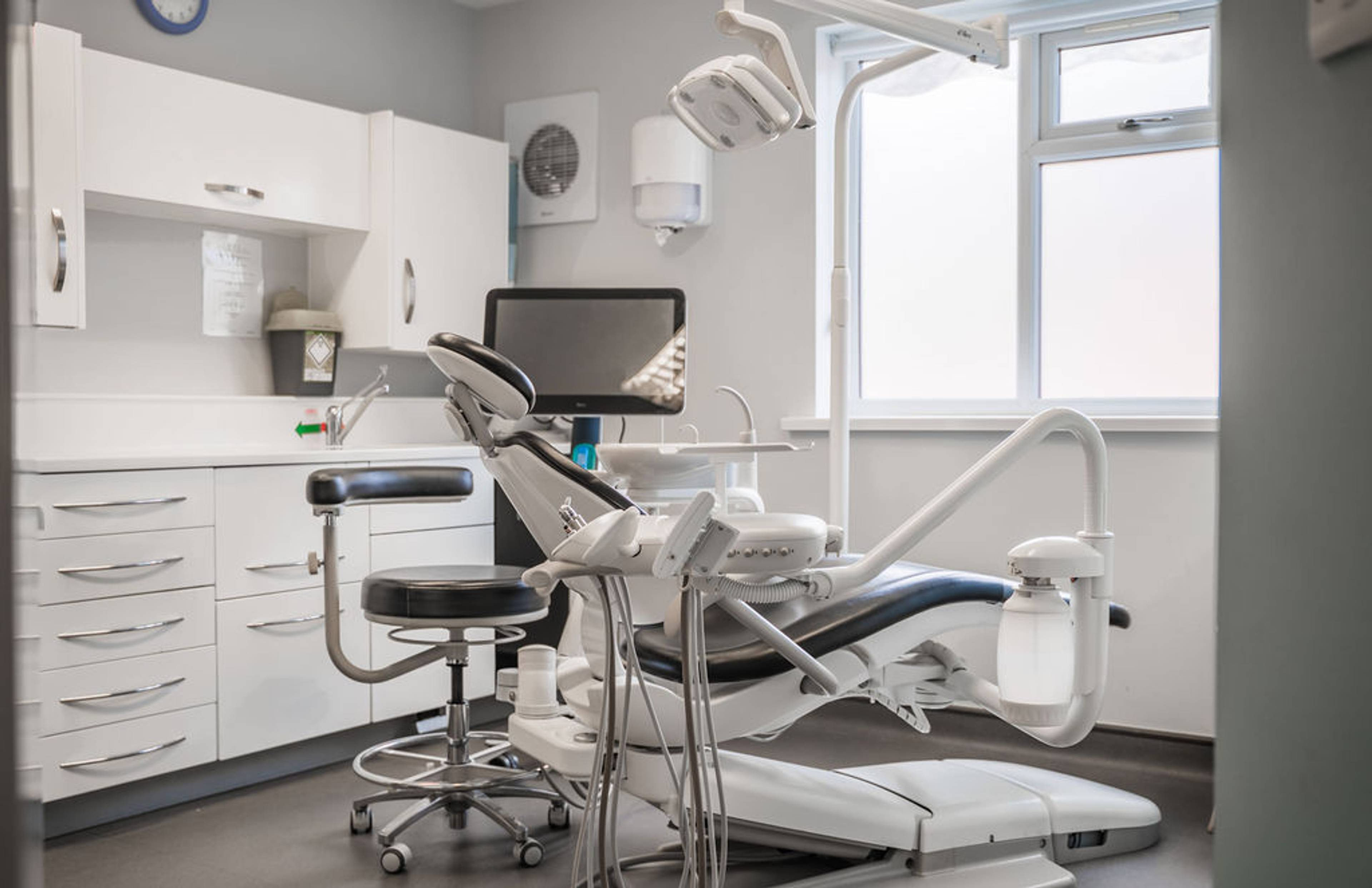 Modern dental treatment room at Pontesbury Dental featuring advanced equipment, a patient chair, and a clean clinical environment for general and cosmetic dentistry treatments.