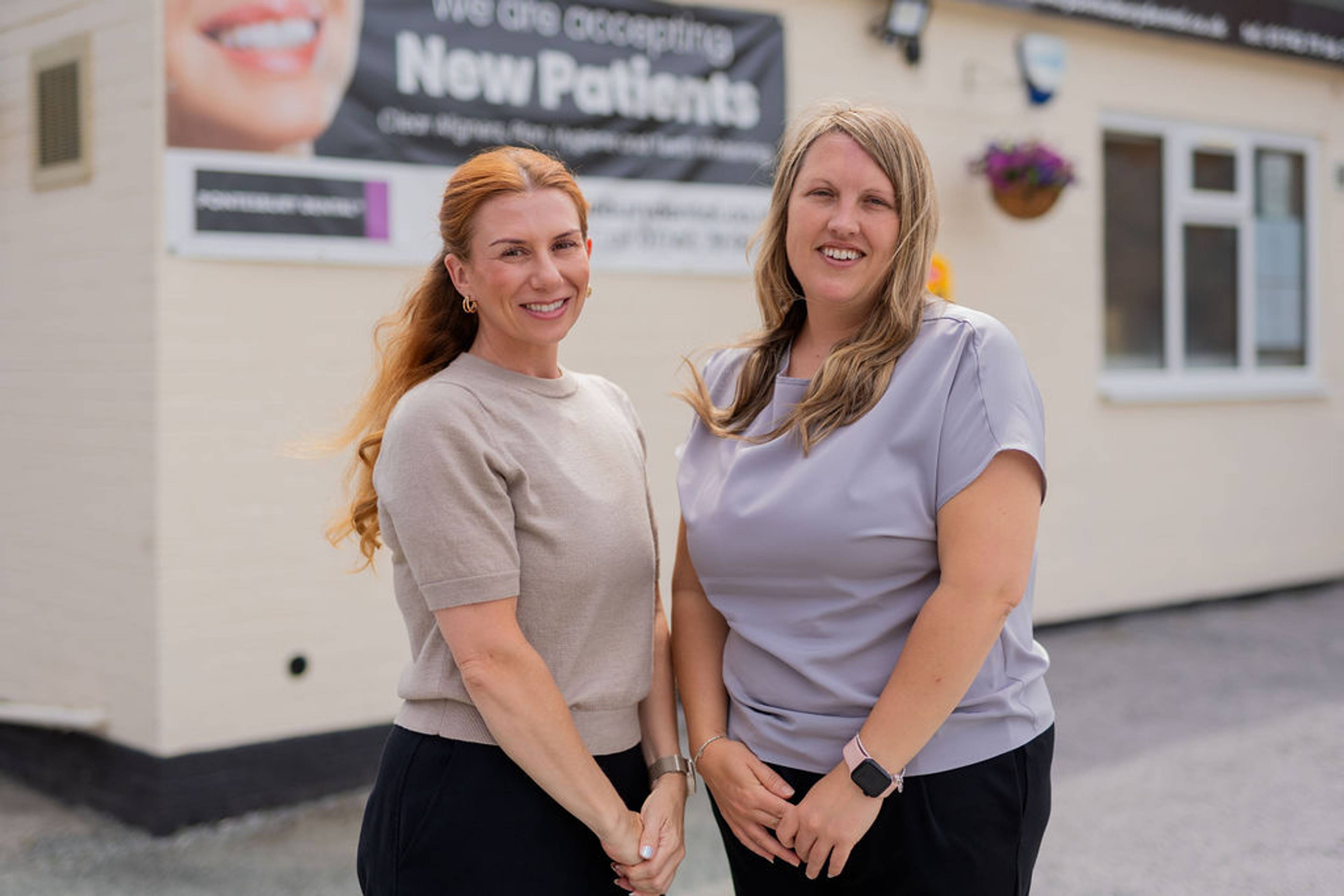 Friendly dental practice team members standing outside Pontesbury Dental, welcoming new patients and supporting high-quality general and cosmetic dentistry services.