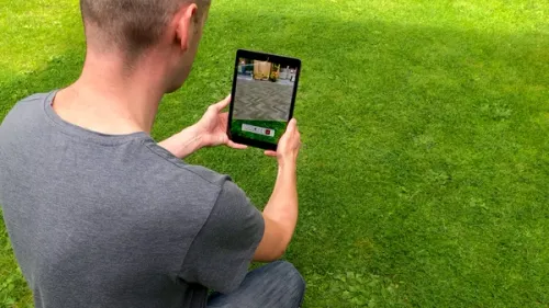 View over the shoulder showing the Marshalls Outdoor Reality AR app on a tablet device