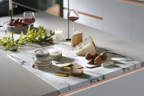 Christmas themed CGI of cheese and crackers on a marble worksurface
