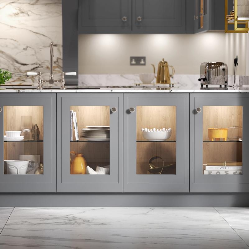 Grey kitchen cabinetry glazed at base level to create an elegant breakfast bar display case