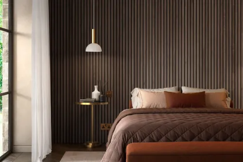 Walnut acoustic wall panel lifestyle image in a bedroom scene with a warm orange and gold palette.