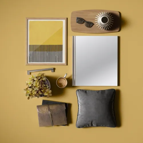 CGI flatlay image with a vibrant yellow theme alongside organic props and accessories