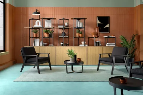 Modern 3D rendered interior design with two grey chairs and a coffee table in front of a modular shelving system