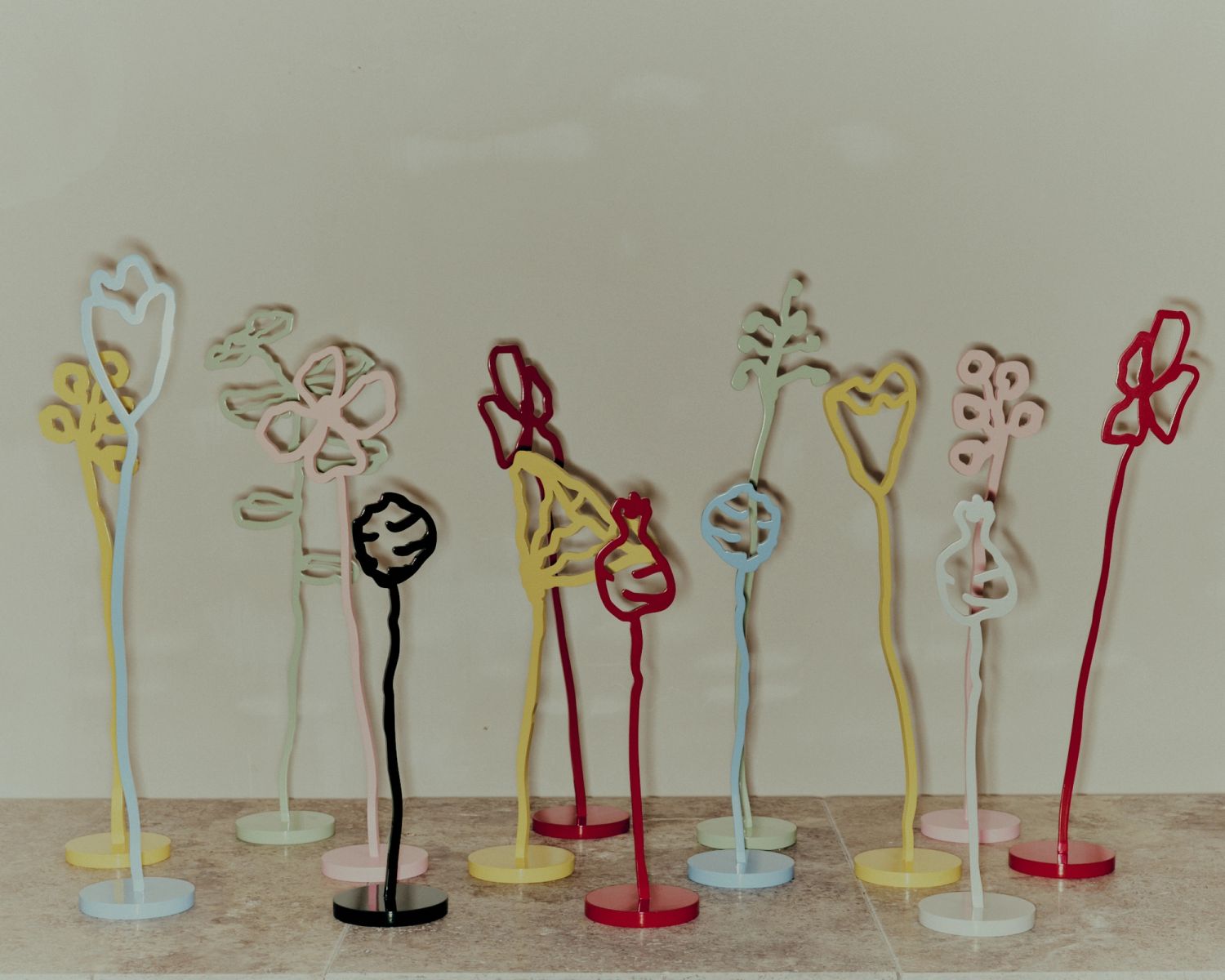 Forget me nots (2025). Powder coated aluminium, variable sizes 33-52 x 9cms
