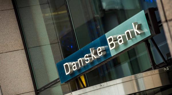 a computer is on a desk under a sign that says tax free